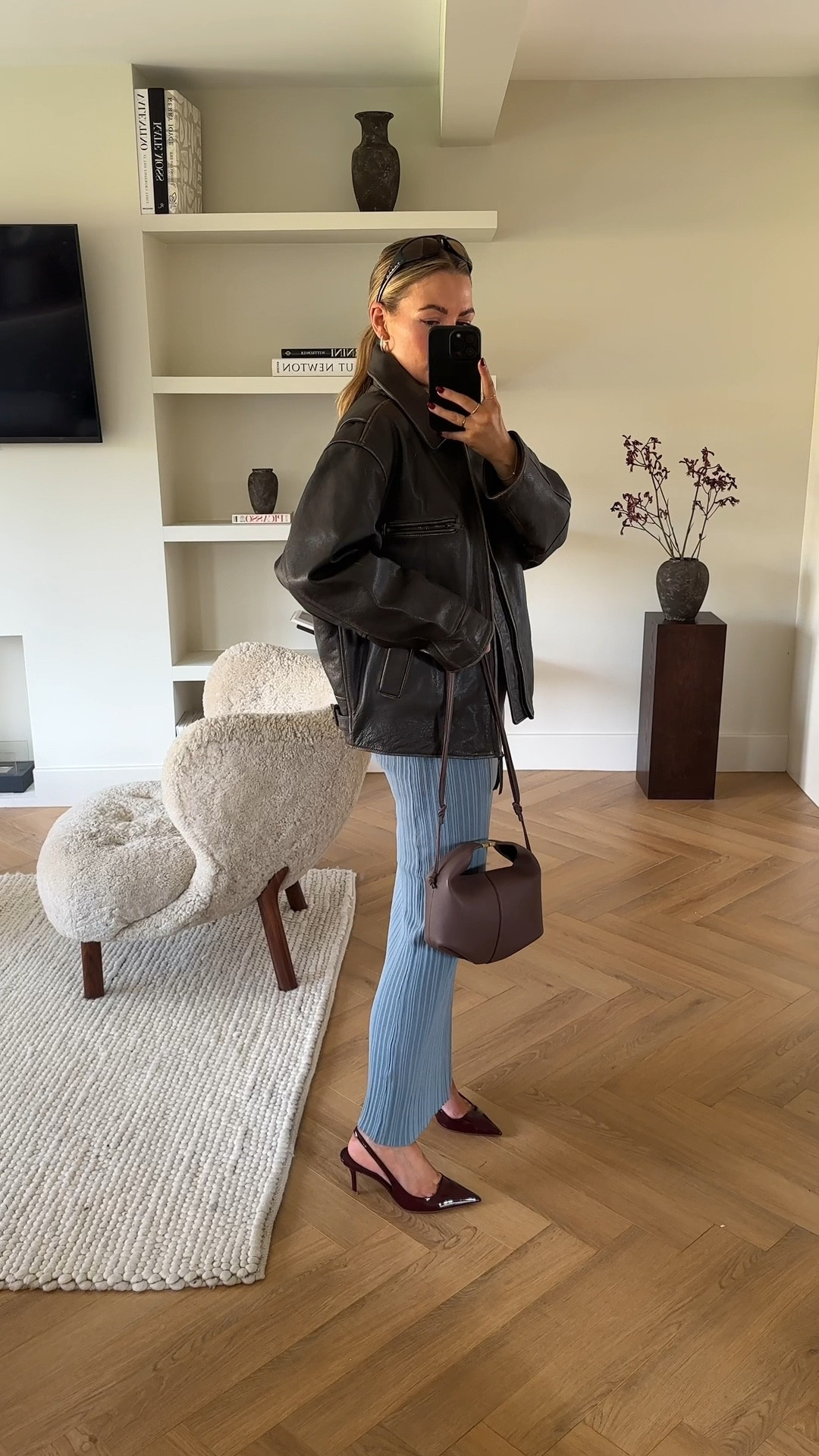 Another recent look! 

I really love the light ice blue against the brown rustic coat also adding burgundy details. 🤍 

The coat is leather from mango, henne coord, polene Paris bag, and cherry red heels from mango. 

#LTKstyletip #LTKfindsunder50 #LTKfindsunder100