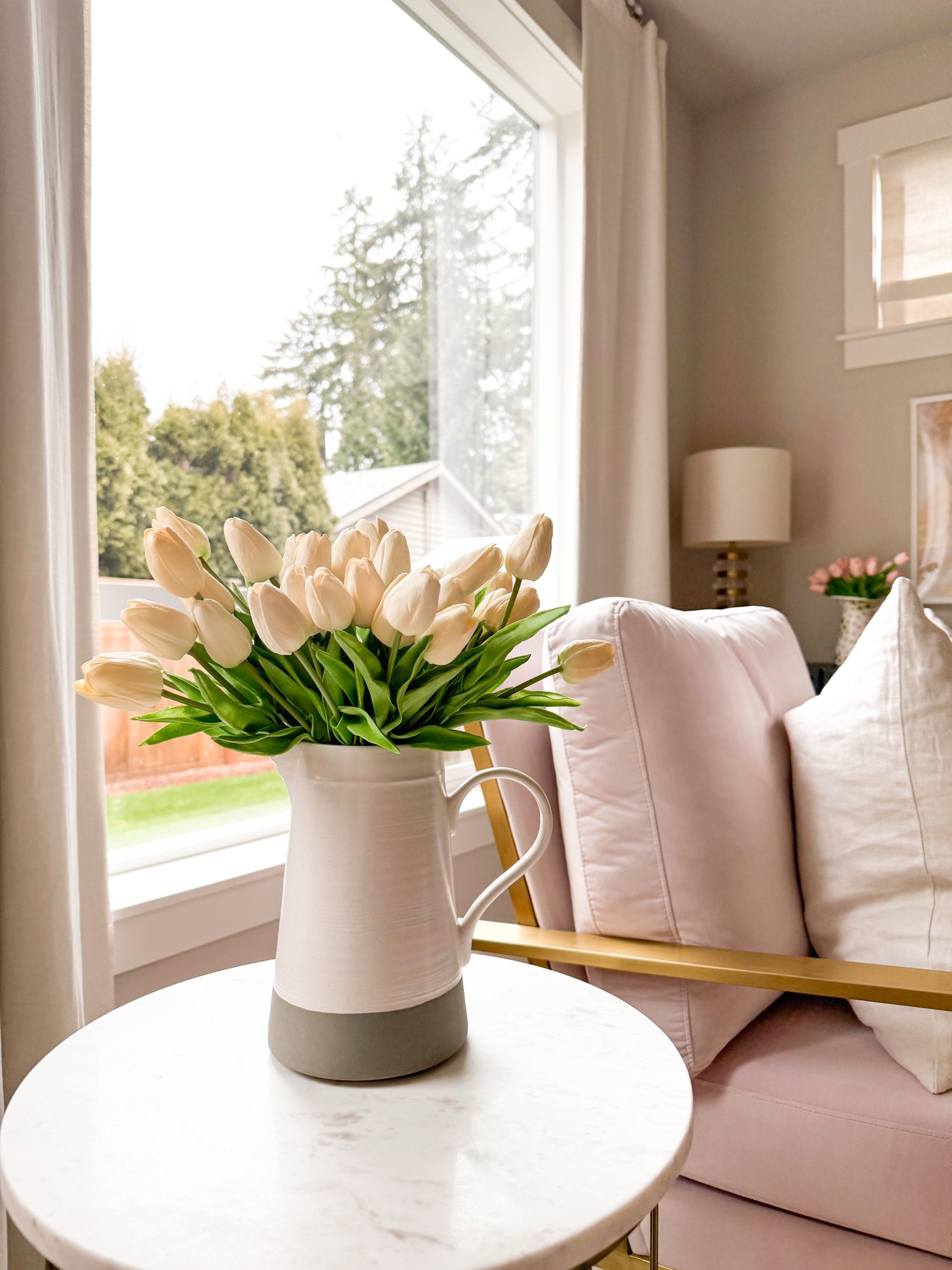 Living room decor with marble top round table and armchair! 

Tulips, table lamp, frame

#LTKSeasonal #LTKHome #LTKWatchNow