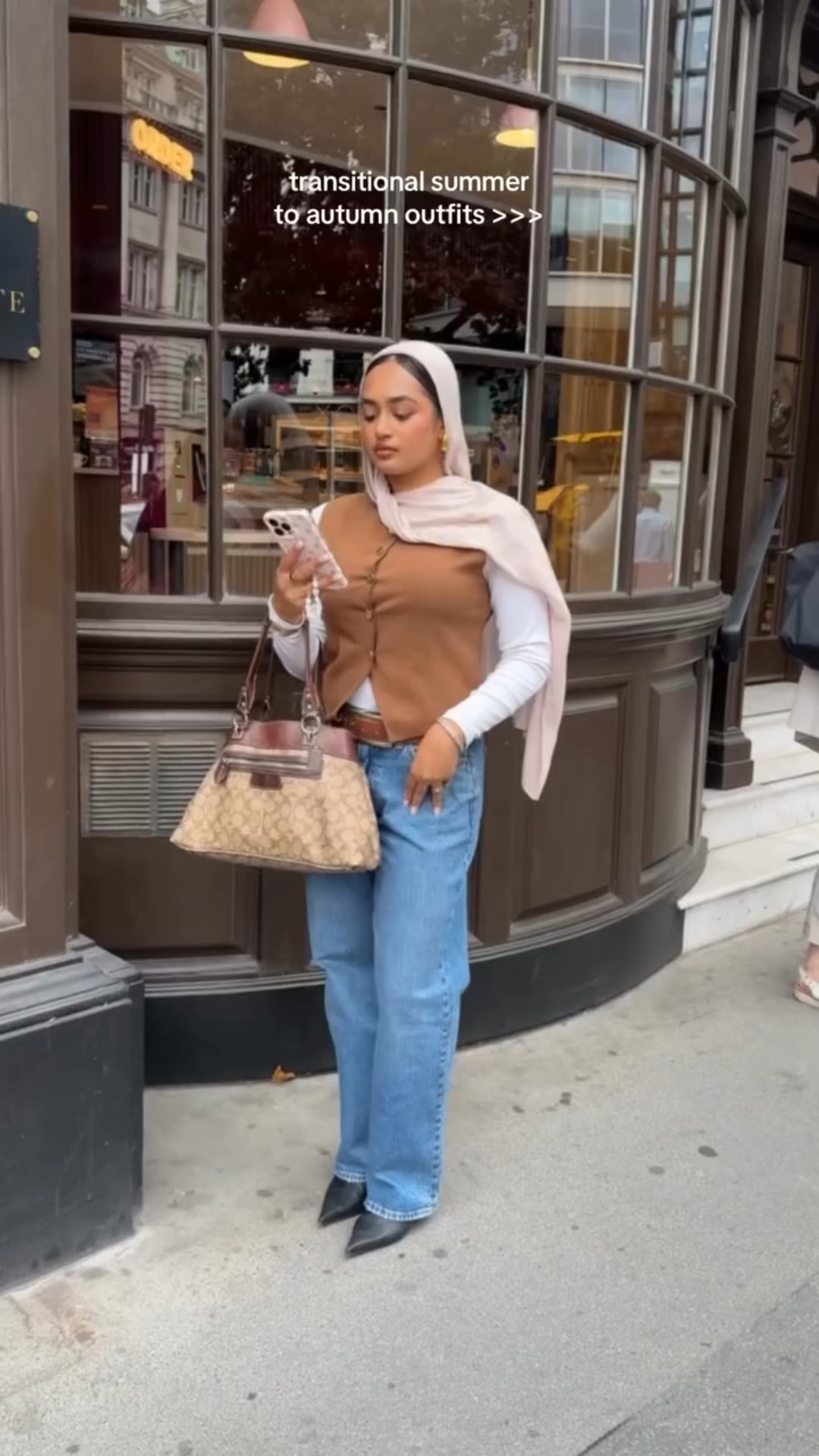 effortless but put together outfits for transitioning from summer to autumn 🍂☕️✨🍁🪞

Fit details are linked in my LTK 
Jeans: @abercrombie 
White top: @stradivarius 
Brown sleeveless vest: @hm 
Kitten toe heel boots: @asos 
Phone case: @coconutlaneuk 
Bag: vintage @coach 

#autumnoutfits #falloutfitinspo  #pinterestaesthetic #fitcheck #autumnoutfitideas #modestoutfitideas #modestfashion #thatgirl #chicoutfit