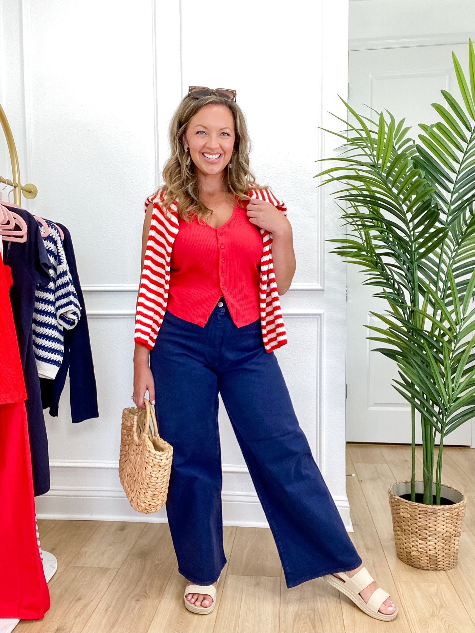 Wearing one of my favorite coastal-inspired outfits for summer! ⚓️ These navy wide leg sailor jeans from Target are SO flattering and give major New England vibes—paired with a red ribbed vest tee and a striped red sweater tossed over the shoulders for a classic nautical look. Perfect for Memorial Day, 4th of July, or any coastal getaway 🇺🇸 Add in straw accessories for a chic, effortless finish! I’m 5’5”, size 8/10, wearing a Medium top and Size 10 in the jeans. 

 #TargetStyle #4thofJulyOutfit #MemorialDayLook #NauticalStyle #CoastalGranddaughter #PreppyStyle #SummerOutfitInspo #TargetFashion #NewEnglandStyle #RedWhiteAndBlue #TargetOutfit #SailorJeans #SummerStyle #LTKsummer #LTKHoliday #LTKtarget #LTKSeasonal #LTKMidsize #LTKFindsUnder50