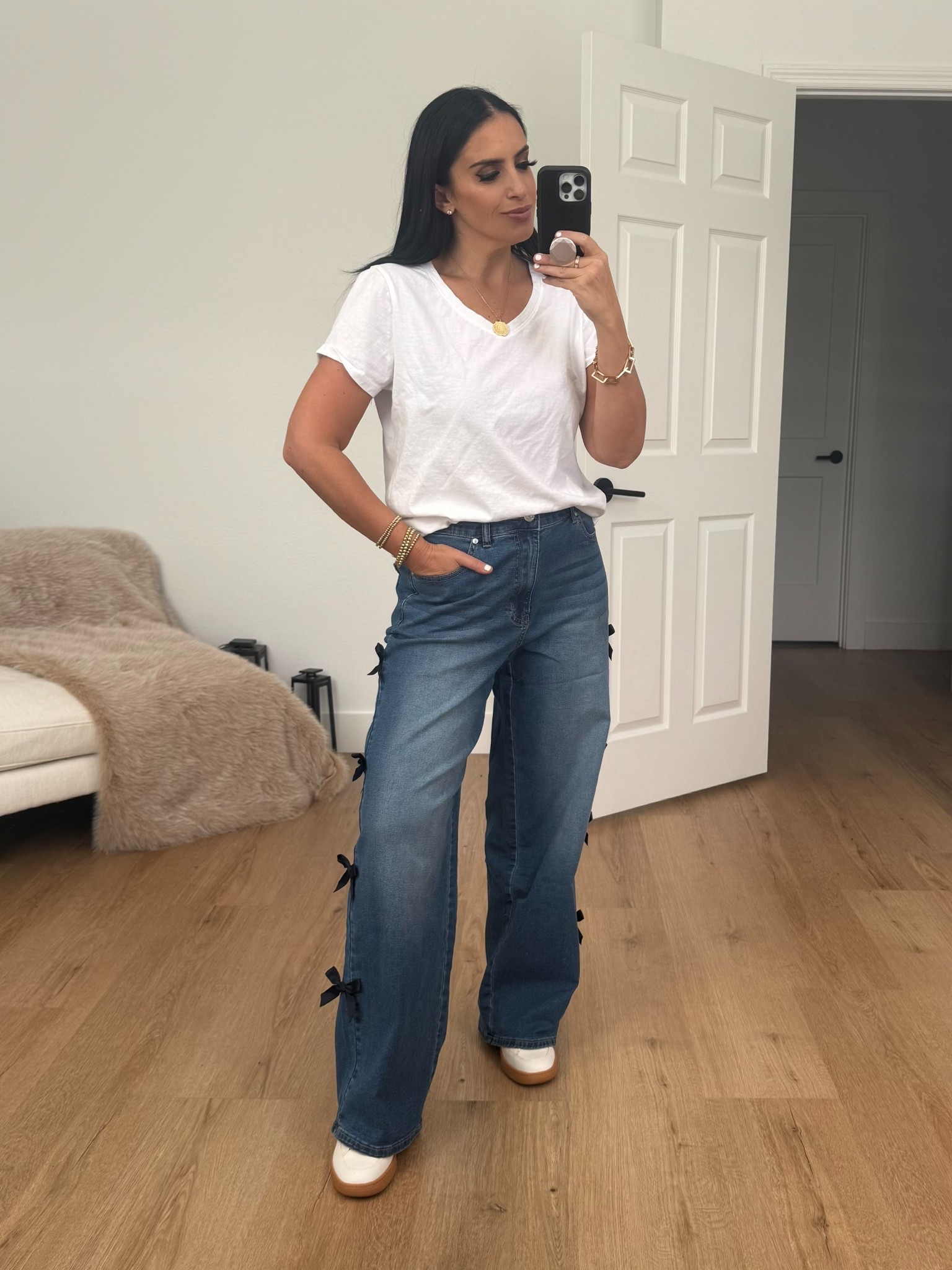 Madden NYC Women's Bow Jeans wearing size medium. Time and Tru Women's Pima Cotton Blend V Neck Tee wearing size medium. 
