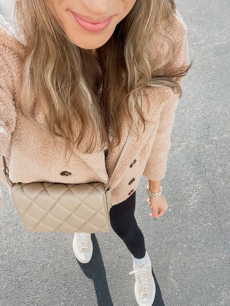 Teddy jacket, quilted crossbody bag, knit beanie, black leggings, sherpa converse high tops 