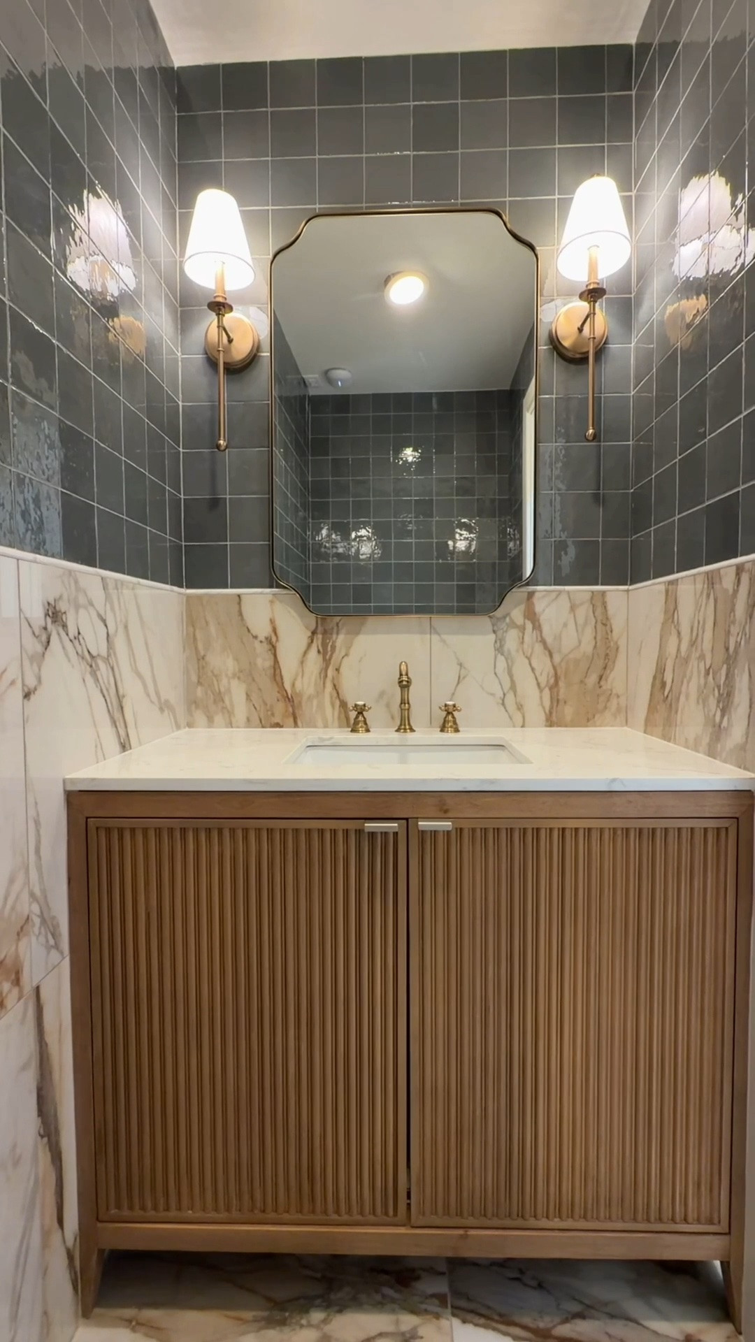 Biggest regret building this bathroom…
that I didn’t find this tile sooner! Seriously though, I have no regrets on how this bathroom came
together.
Bold depth of the 4x4 Handcrafted Artistry tile in the color Ocean Twilight which is truly a
chameleon color of blue-grey and a hint of green.
Core Classic Marble Manor Calacatta Jolly is the perfect transition detail that makes the space
feel custom.
Large-format Calacatta Topaz makes the whole space feel bigger, and who doesn’t love fewer
grout lines to keep clean?
We used all Daltile Products available at Lowe’s!