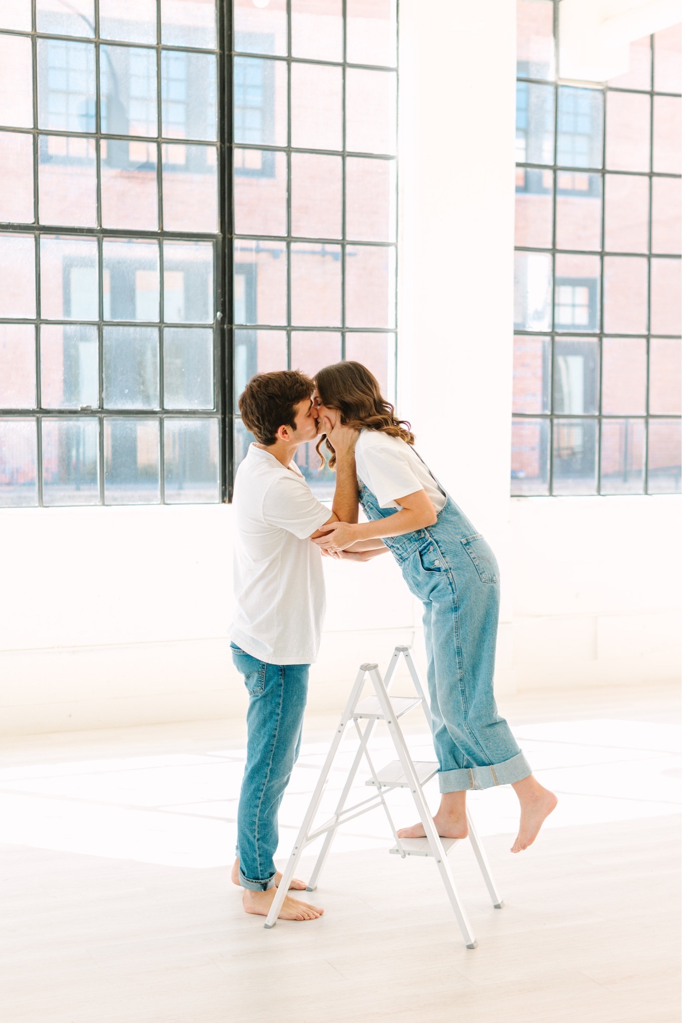Casual engagement photo shoot idea! Denim and white tees are timeless. 🫶🏻🥳 #engagementpictures 

#LTKwedding #LTKfindsunder100