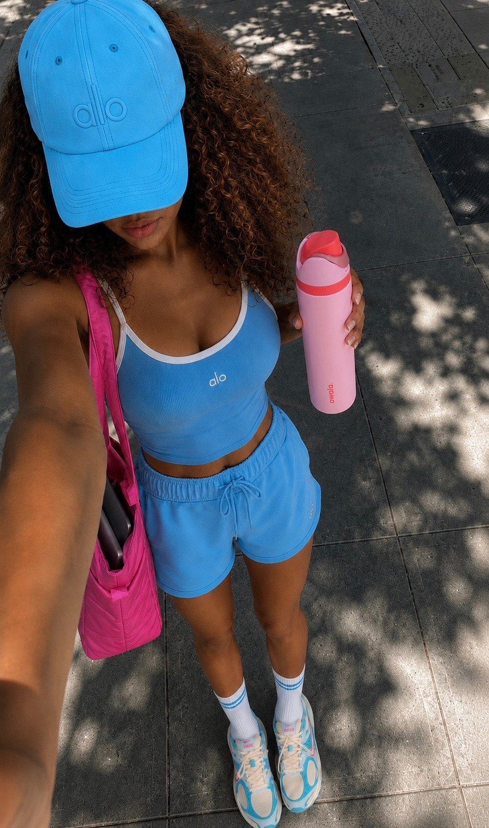 Obsessed with this azure blue Alo set right now 💙 The bra tank + shorts combo is so comfy for errands or a light workout, and I matched it with this Owala bottle because apparently that’s a personality trait now. Sneakers and hat linked too — everything’s true to size!

#LTKdayinmylife #LTKootd #LTKActive