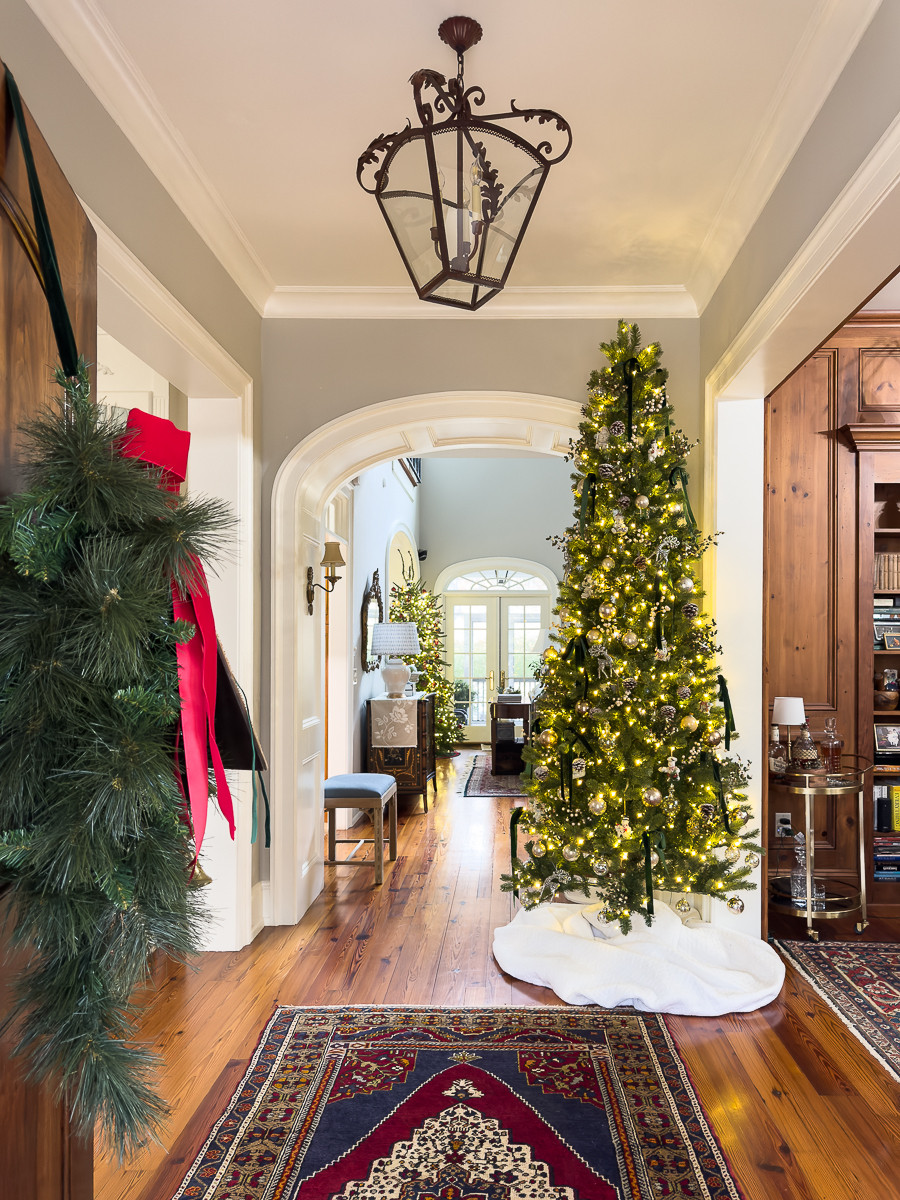 Festive traditional foyer with gorgeous slim Christmas tree from King of Christmas!  

 #LTKHoliday #LTKSeasonal #LTKHome