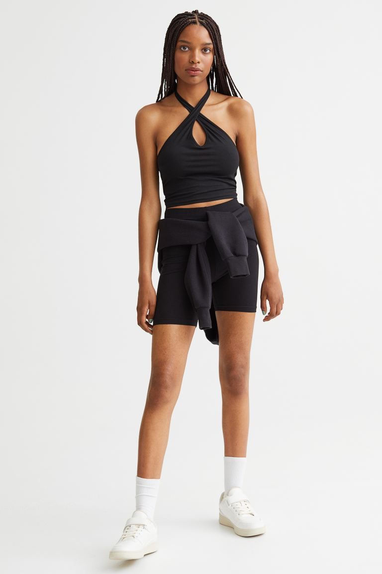 Conscious choice  Fitted, halterneck top in soft jersey. V-shaped neckline at front.SizeThe model... | H&M (US)