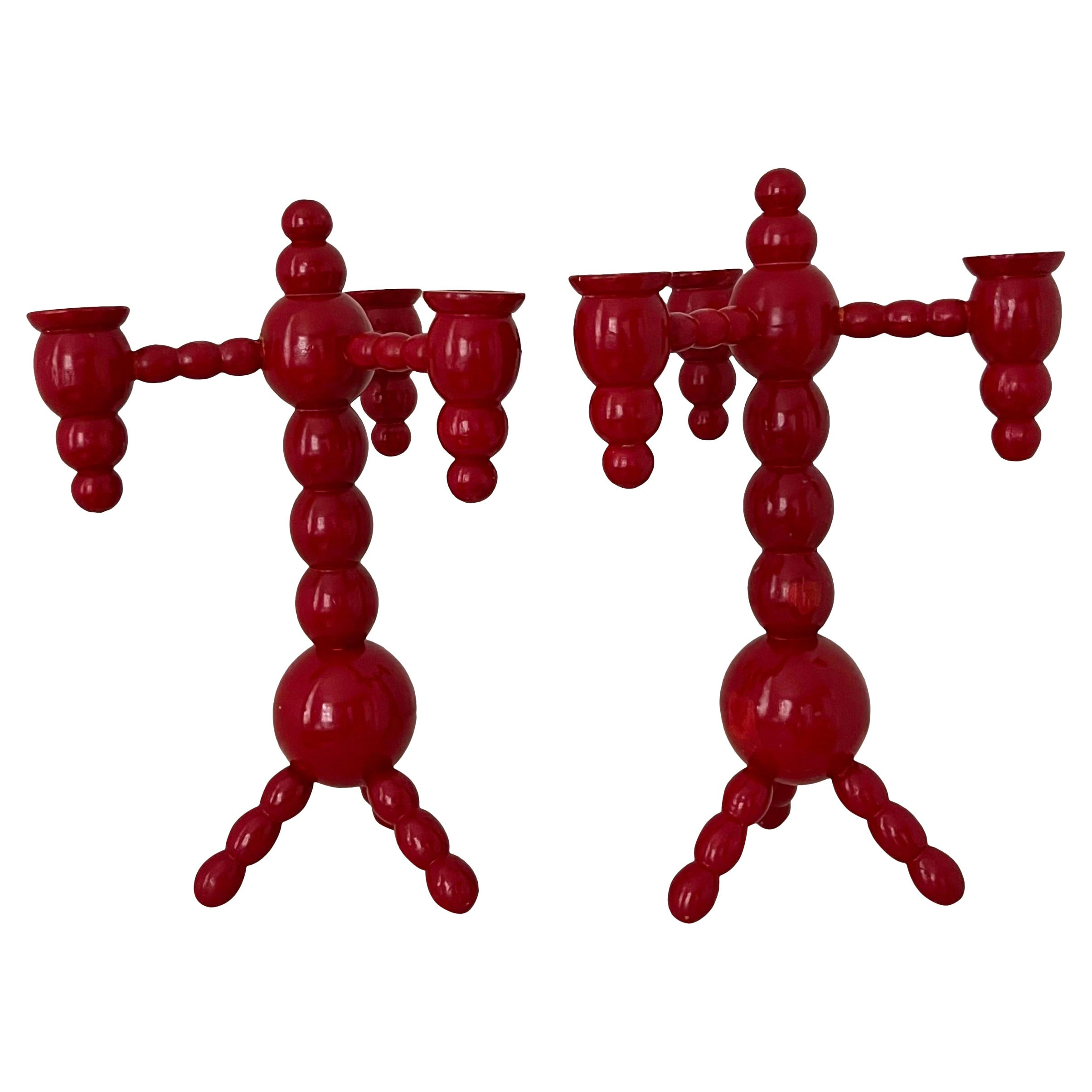 A pair of Swedish Christmas candelabras red painted wood bobbin 1970s | 1stDibs
