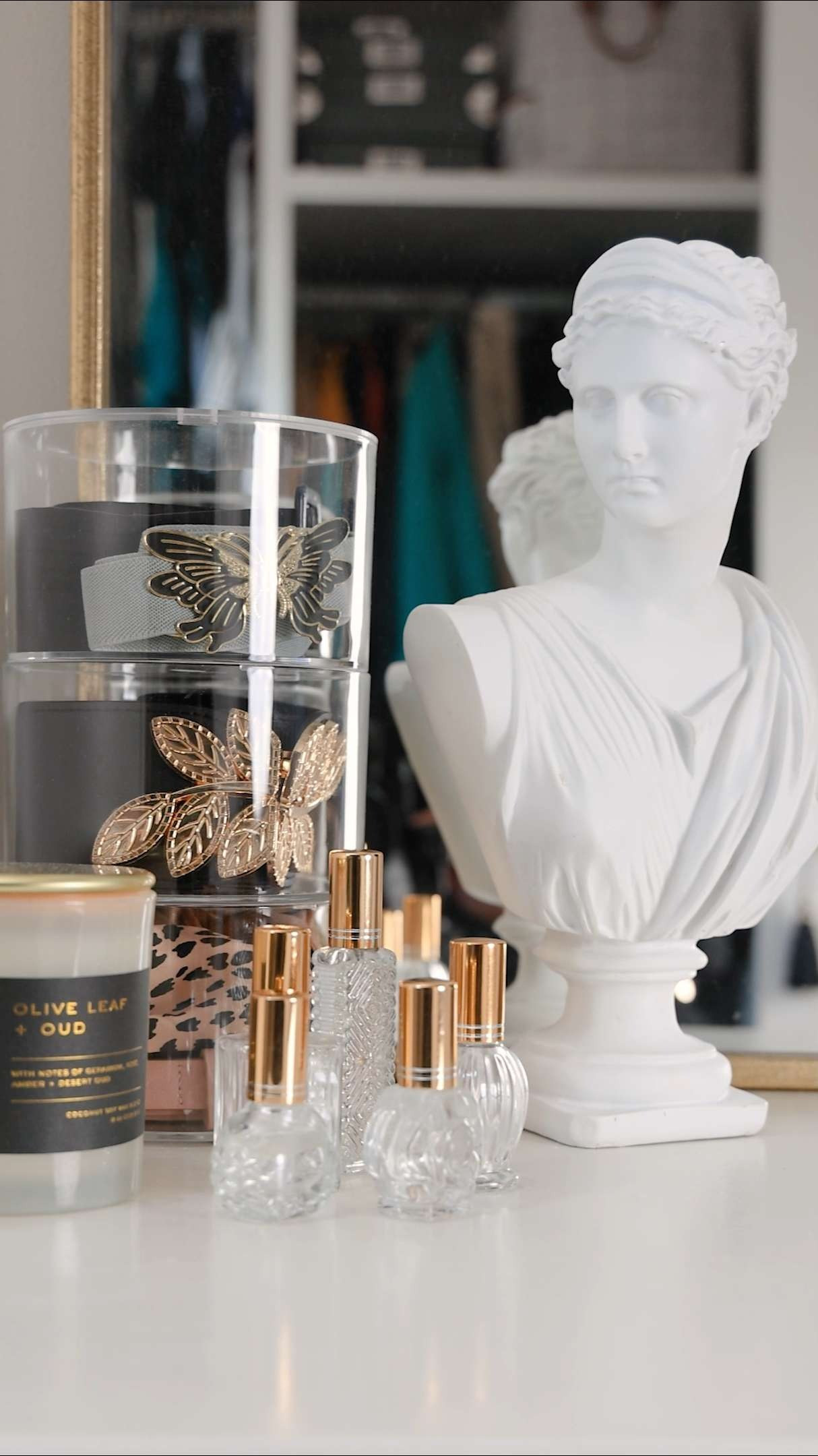 Closet organization & styling | Refillable perfume bottles, candles, belt organizer, and statue bust. 

 #LTKHome