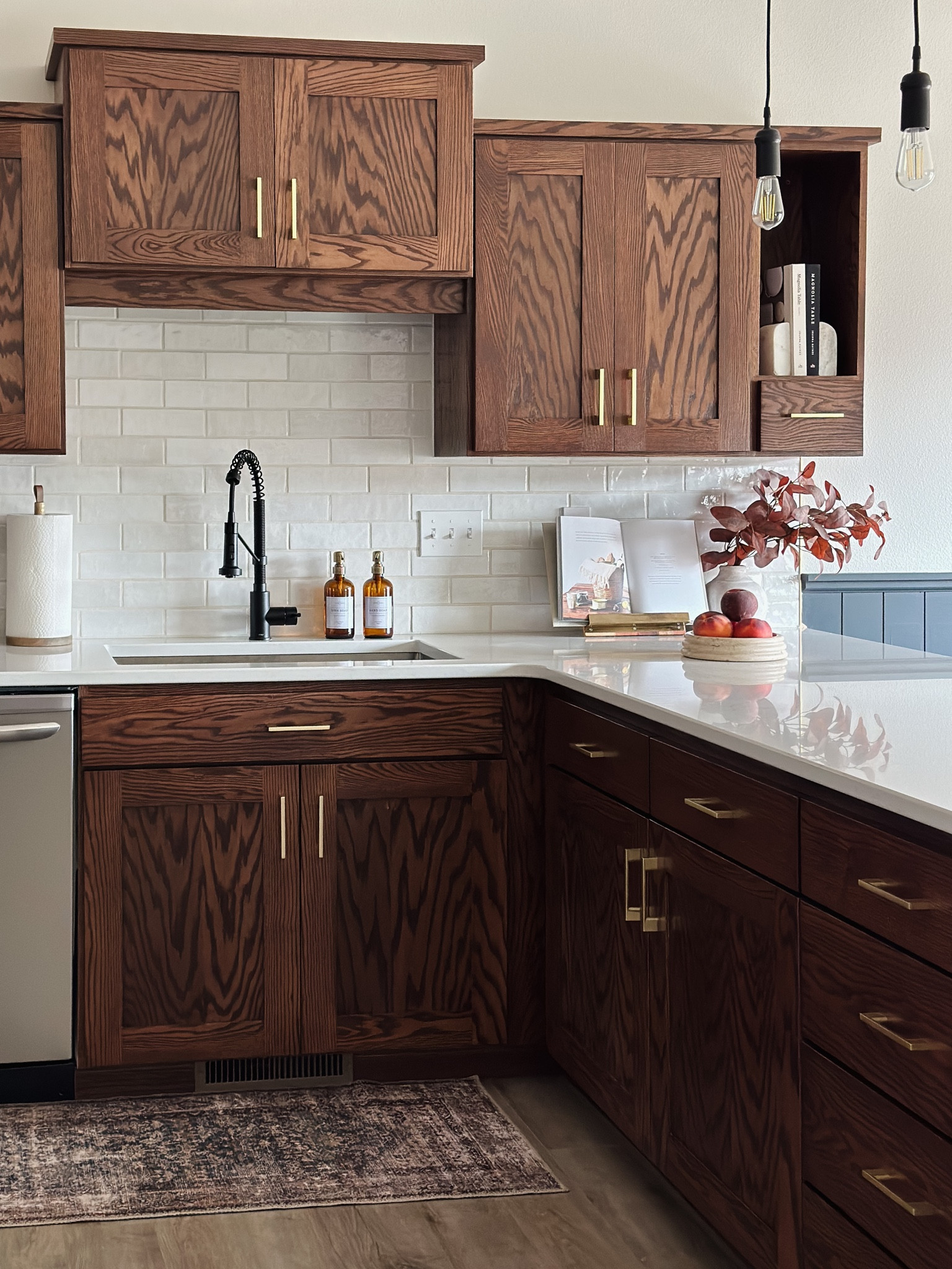 Kitchen renovation reveal!

Use code HAMANNS for 10% off your tile order!

Walnut kitchen cabinets, kitchen inspo, Alexander James ceramic white handcraft tile, white kitchen backsplash, Zellige tile, kraus matte black kitchen faucet, white quartz countertops, vicostone Aspen, studio McGee barstools, black barstools, brass hardware, brass cabinet pulls, kitchen cookbooks, outlet covers 

#LTKhome #LTKstyletip #LTKSeasonal