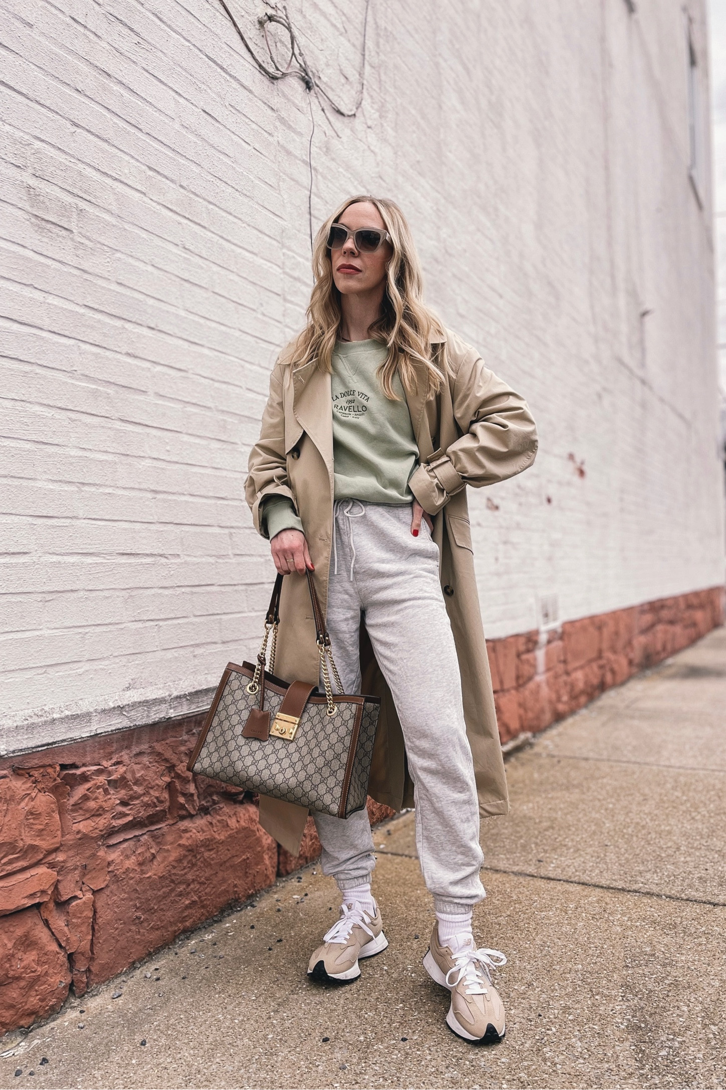 Trench coat, casual spring outfit, sweatshirt, joggers (on sale under $100), New Balance 327 sneakers, Gucci tote bag

#LTKunder100 #LTKsalealert #LTKunder50
