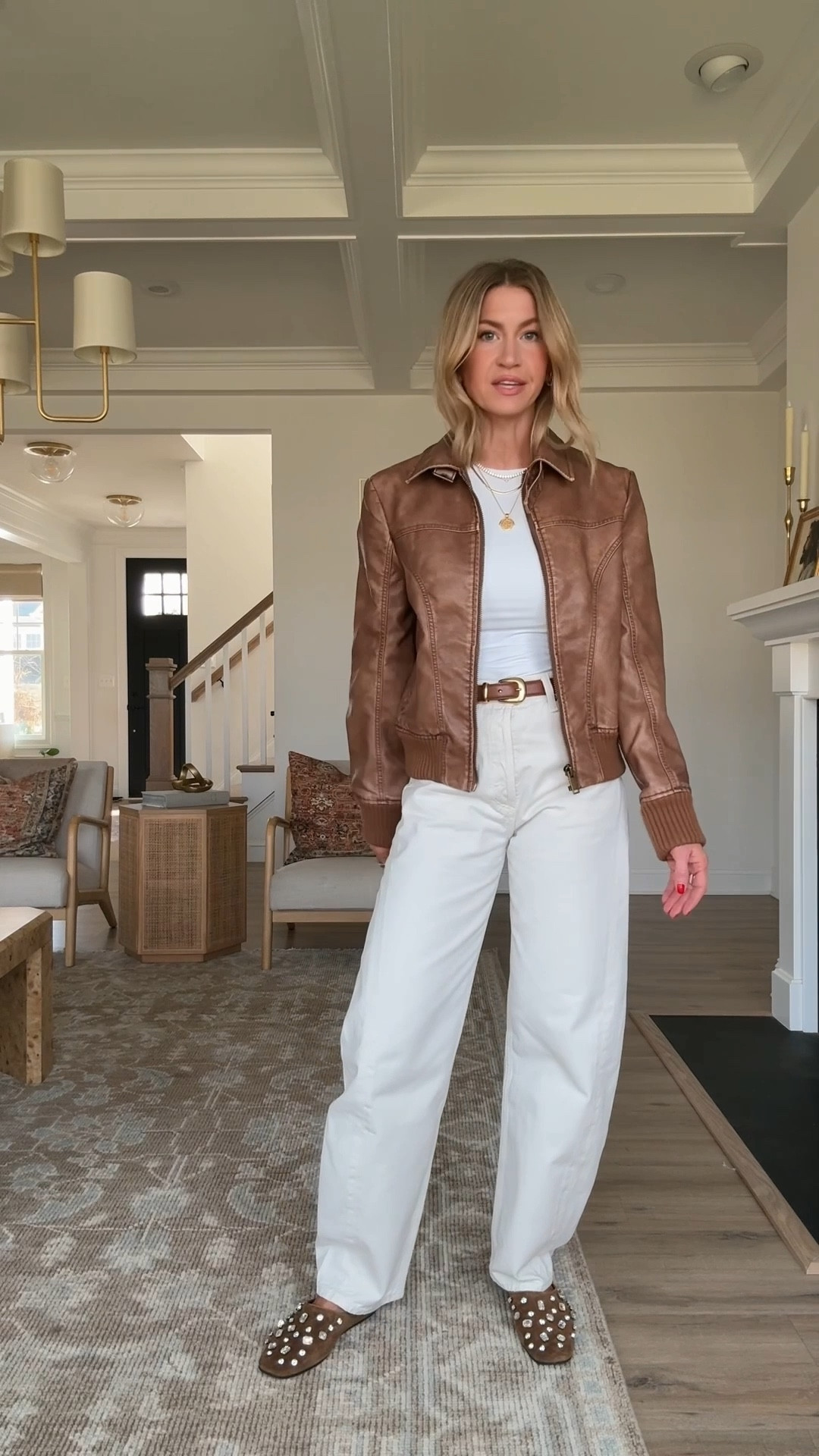 Simple spring outfit for running errands! 

White long sleeve bodysuit: runs small, wearing S
Ecru high rise barrel jeans: runs TTS, wearing a 25
Cognac faux leather bomber jacket: ON SALE, runs very small size up at least 1 size, wearing a M
Bedazzled suede mules: TTS

(Gold double hoop earrings, Cartie Baignoire watch, spring outfit, ecru denim)

#LTKSpringSale #LTKgrwm #LTKootd