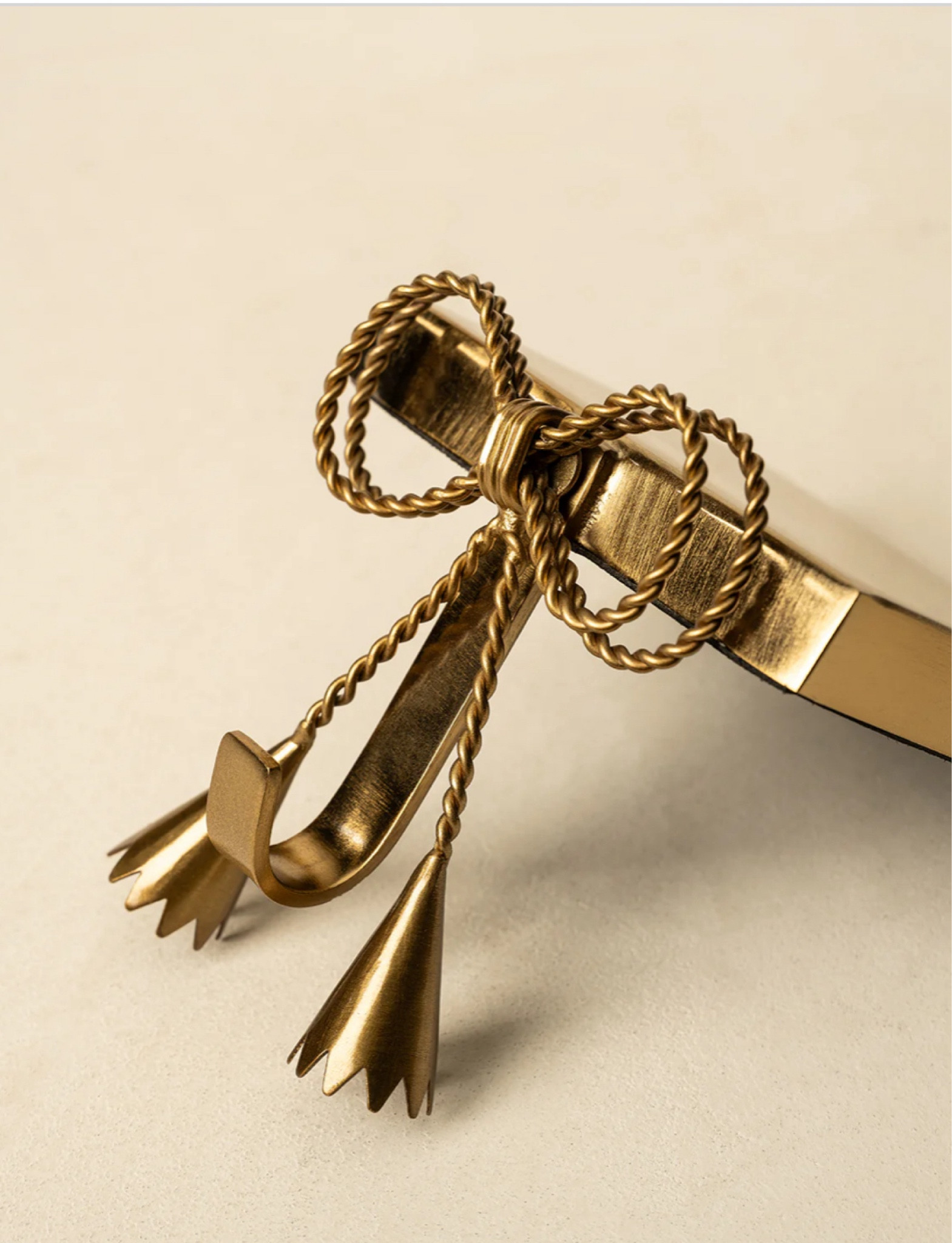 Gold Bow stocking holders from McGee & Co. 

Dress up your Christmas mantle with, Bows 🎀

#LTKHoliday #LTKHome #LTKSeasonal