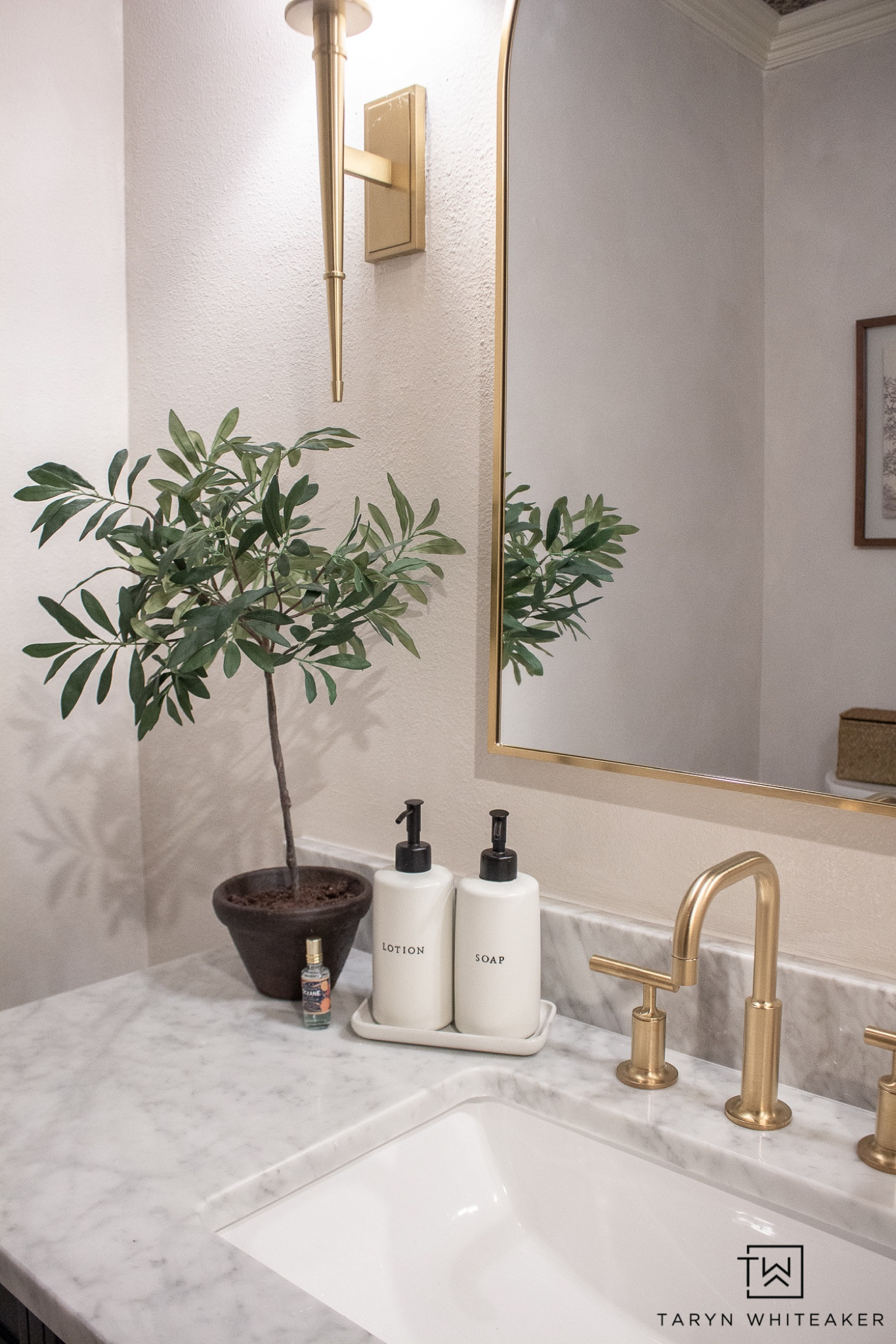 Countertop Styling

Powder room decor  faux plant  gold accent  bath room accessories  marble countertop  wall art  wicker basket  neutral bathroom  home decor

#LTKhome #LTKSeasonal