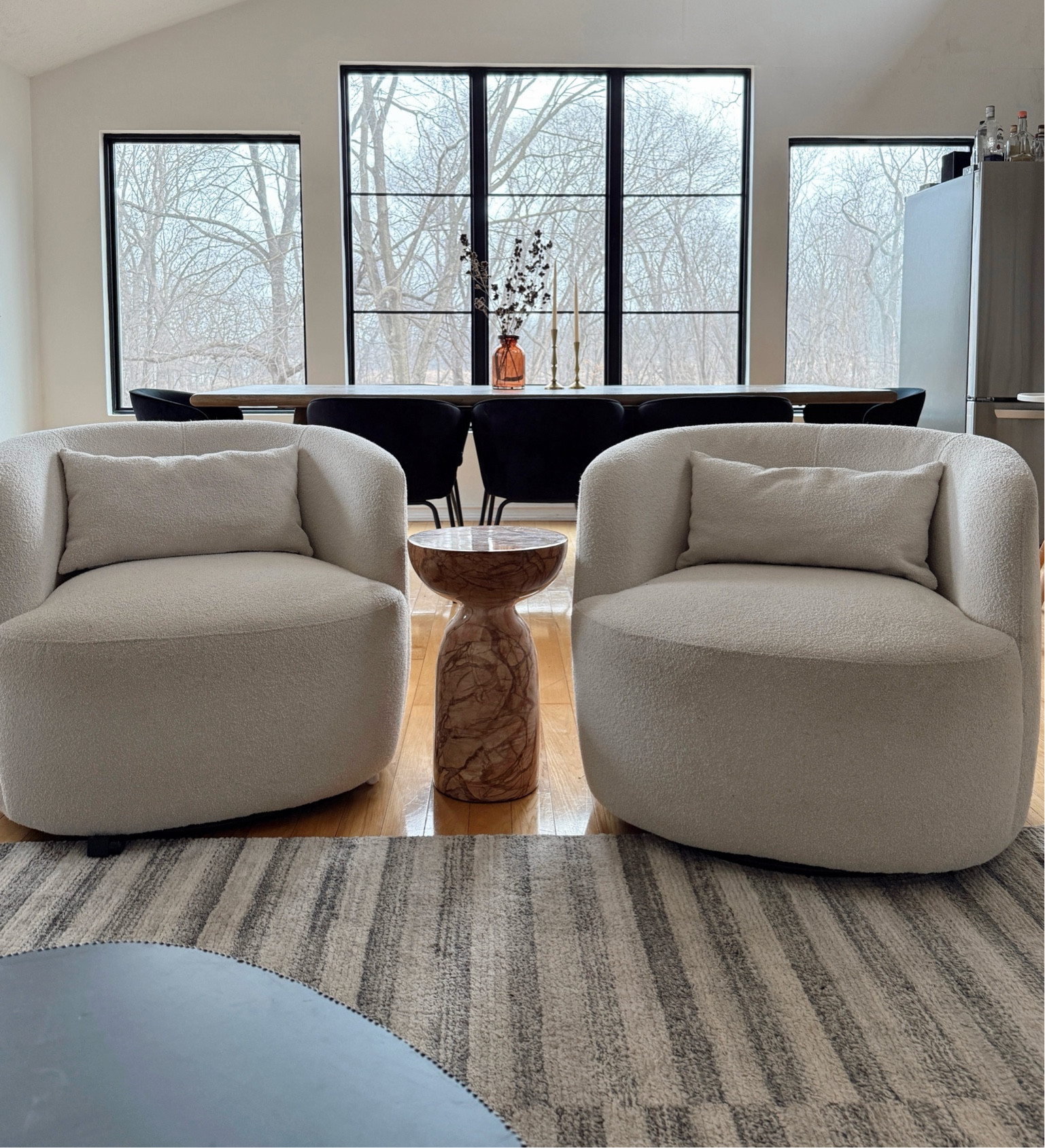 My cozy boucle barrel swivel chairs are on sale at Wayfair! Lumbar pillows included. Marble end table, black dining chairs and modern rug also linked! 

#LTKMostLoved #LTKHome #LTKSaleAlert