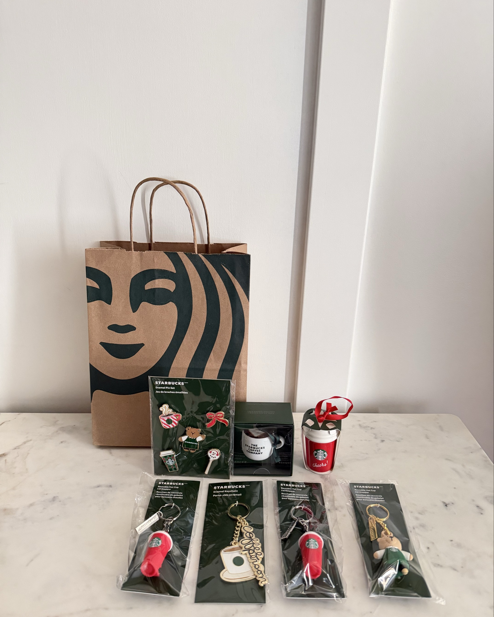 Happy Thursday!☺️ Did you shop for the new Starbucks X Hello Kitty collab or the Starbucks holiday release?🤔 I didn’t find any Hello Kitty, but I didn’t leave empty handed!😂 Here’s what I found and this is from a couple of Starbucks stores this morning!!😍 I love collecting Starbucks ornaments!!🥰 I started when my husband and I use to work there several years ago!😊 These keychains and reusable coffee lid stoppers are super cute!!🤩 They make great gift ideas and I linked some for you!!🎄🎁 😄


#starbucks #starbuckskeychain #starbuckslidstoppers #targetmomof10 #starbucksholidayrelease #starbuckshaul #shopwithme #starbuckshaul #starbucksholidayfinds #starbucksfinds #starbucksholiday2025 #starbuckschristmas #starbucksornaments #coffeeaddict #christmasornaments #giftideas #coffeelover 

#LTKHoliday #LTKOver40 #LTKGiftGuide