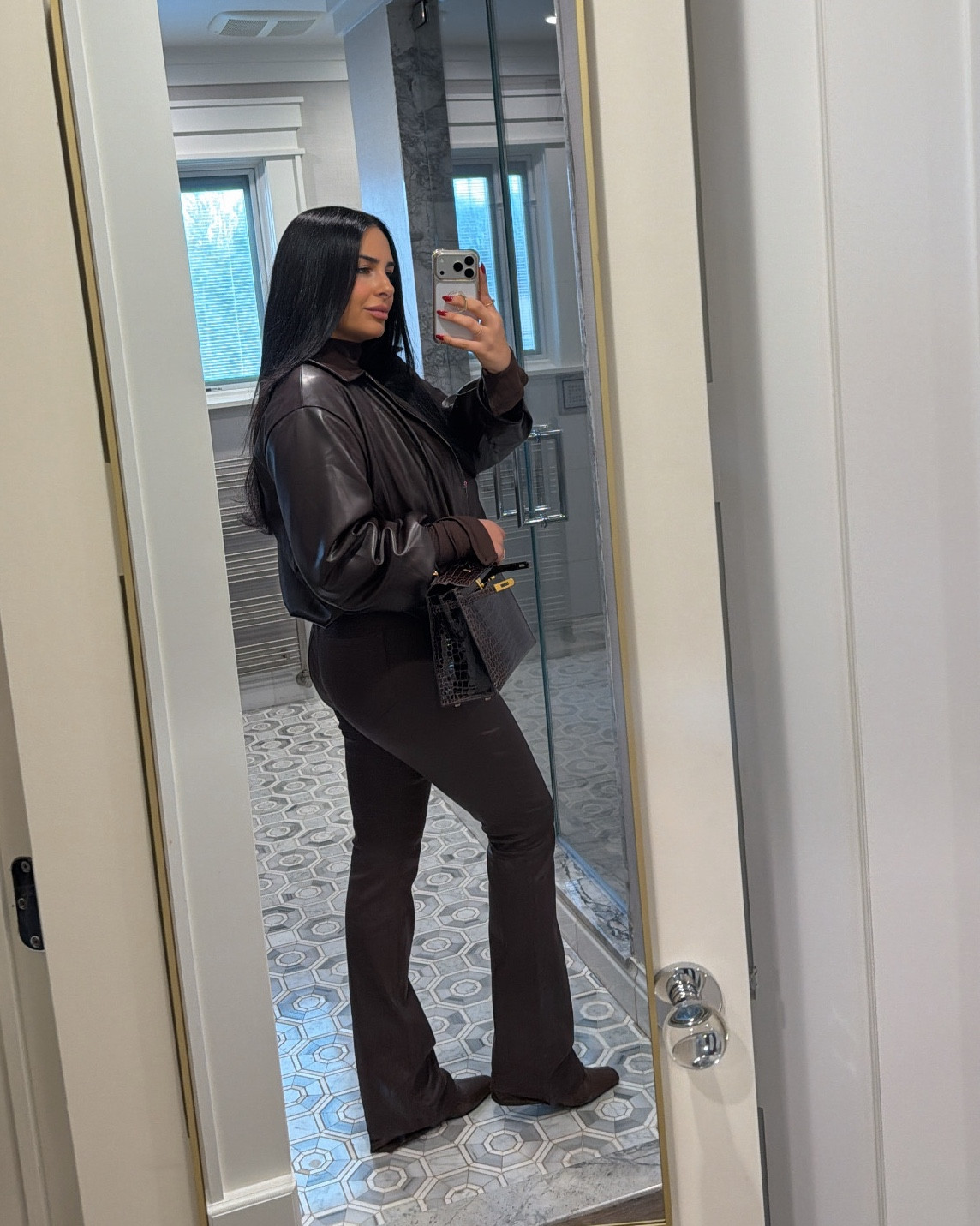 Brown bomber, brown coated jeans, brown boots, brown bodysuitt