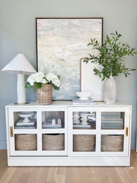 Sliding glass cabinet from the studio, McGee line at target. Layered art, coastal, artwork, woman, baskets, toy storage, office, storage, entryway, table, target lamp, coastal home, modern, coastal, interior design. Paint color is Boothbay gray.

#LTKhome #LTKstyletip #LTKsalealert