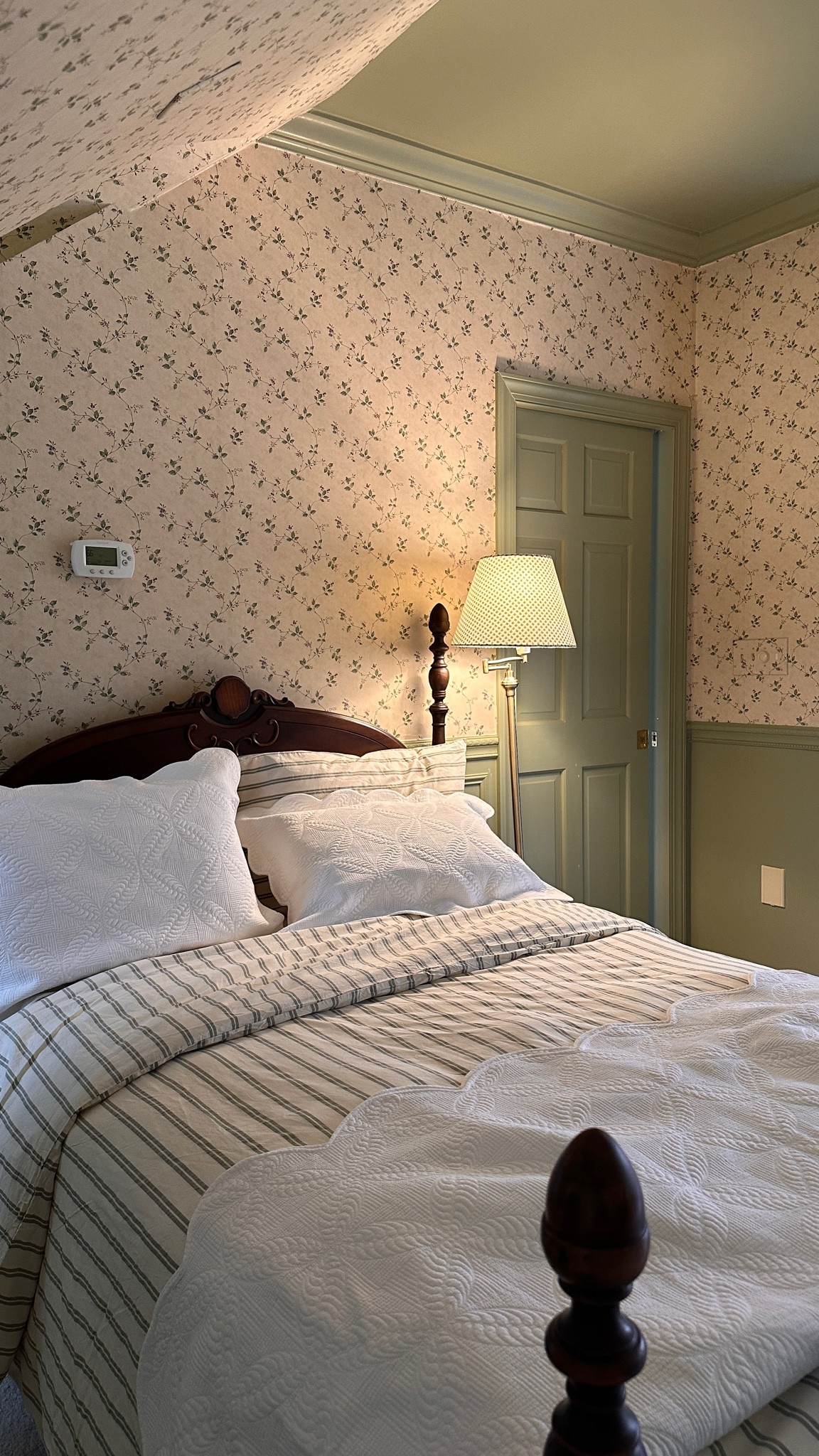 Guest bedroom refresh - comfortable bedding. I love how the lines look with the floral wallpaper, scalloped trim quilt and the mattress is layers and layers of comfort with a cooling top layer. The lamp shade is old from Etsy. The Company Store is 25% off site wide using code FAMILY24

#LTKhome