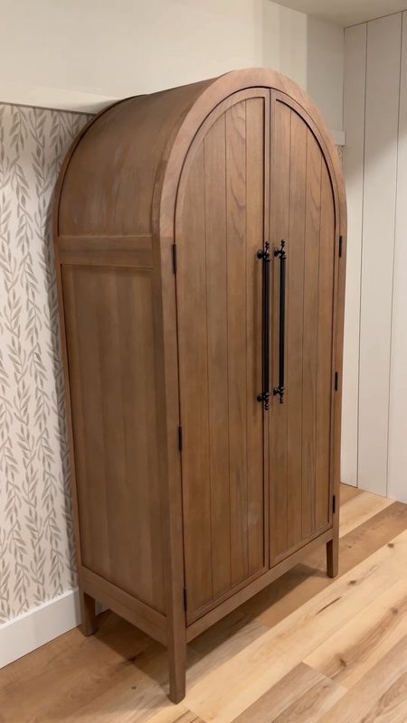 Beautiful solid wood arched cabinet. Half the price of the designer ones in a similar style. Comes in a bunch of colors and is delivered fully assembled. Mine is the antiqued neutral color. 

#LTKhome #LTKstyletip #LTKVideo