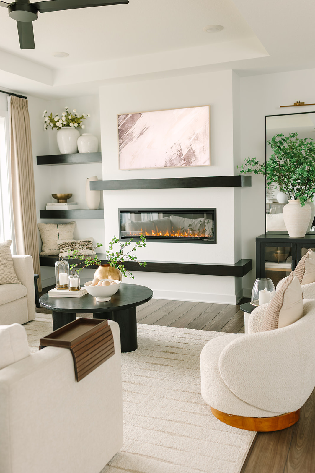 My rug is a showstopper 🤍 And it’s on sale, which makes it the kind of piece you design a whole room around, especially with swivel chairs, TV art, a coffee table, couch, and accent decor layered around it. 

 

#LTKHome #LTKSaleAlert