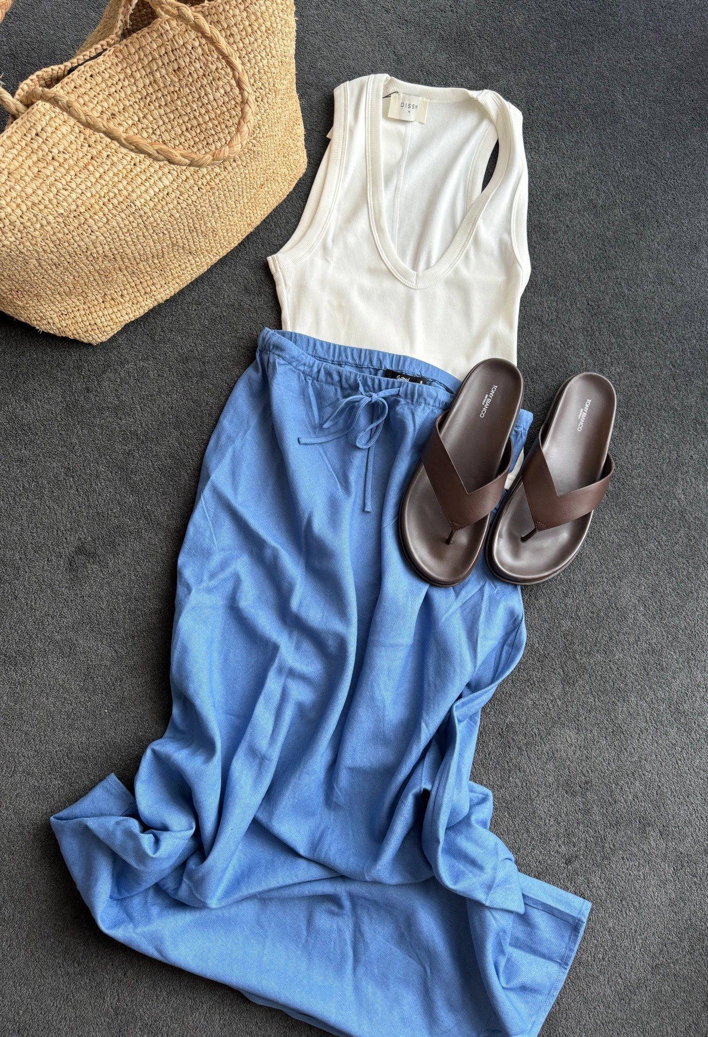 Summer holiday packing 🌺☀️
Tank: DISSH, size M (size up) 
Sandals: Tony Bianco, LOOP, I sized up 
Skirt: Sportsgirl, this colour isn’t available online yet but is in all stores 
Bag: Massimo Dutti (dupes linked) 

I styled this with a cropped denim oversized jacket for a travel day 

#LTKsummer #LTKaustralia