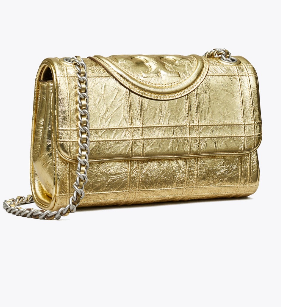 Must have small Fleming Soft Convertible Shoulder Bag is made of subtly distressed leather with a grid pattern, sealed with a bombé Double T. Braided with brushed chain, the strap can be worn doubled over the shoulder or long and crossbody @toryburch #toryburch #holidaycollection 

#LTKGiftGuide #LTKHoliday