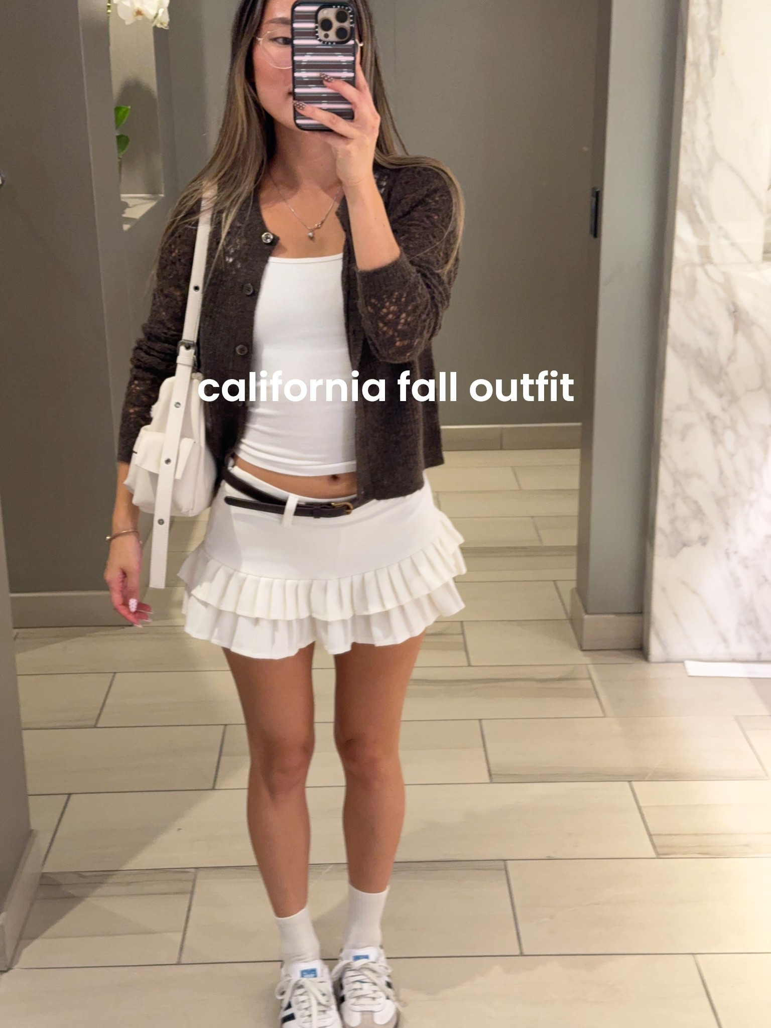 california fall outfit! and my brown cardigan is on sale rn for 31% off! wearing an XS :) 

warm fall outfits, warm weather fall outfits, california fall outfits, neutral fall outfits, white mini skort, styling sambas 

