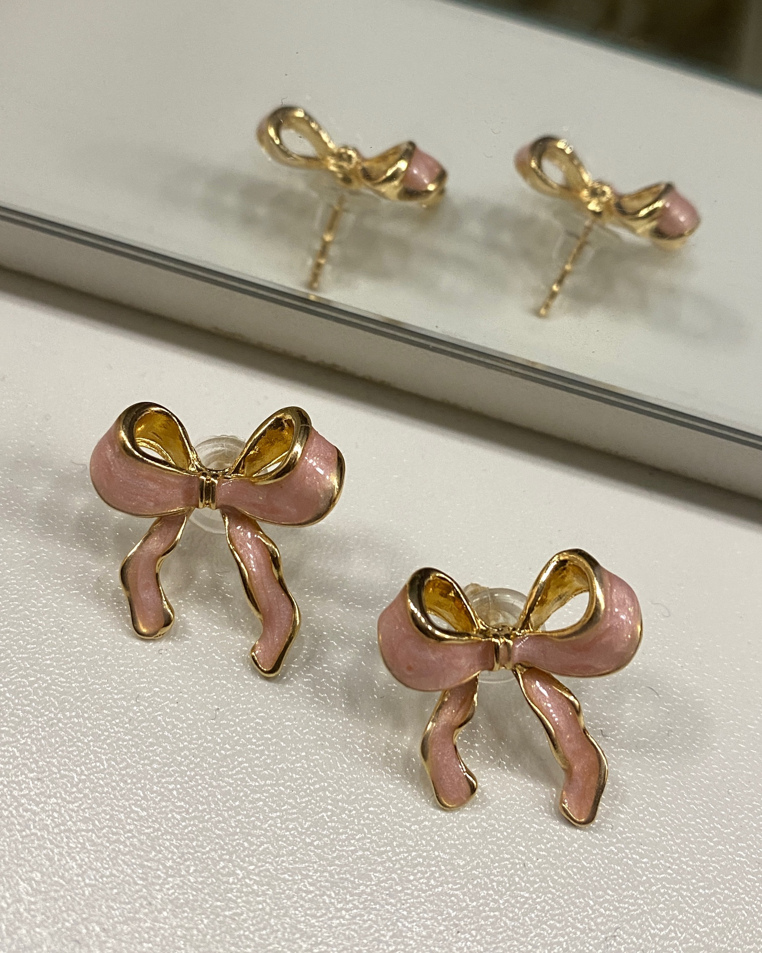 Pink bow earrings 

#LTKBeauty #LTKFindsUnder50 #LTKStyleTip