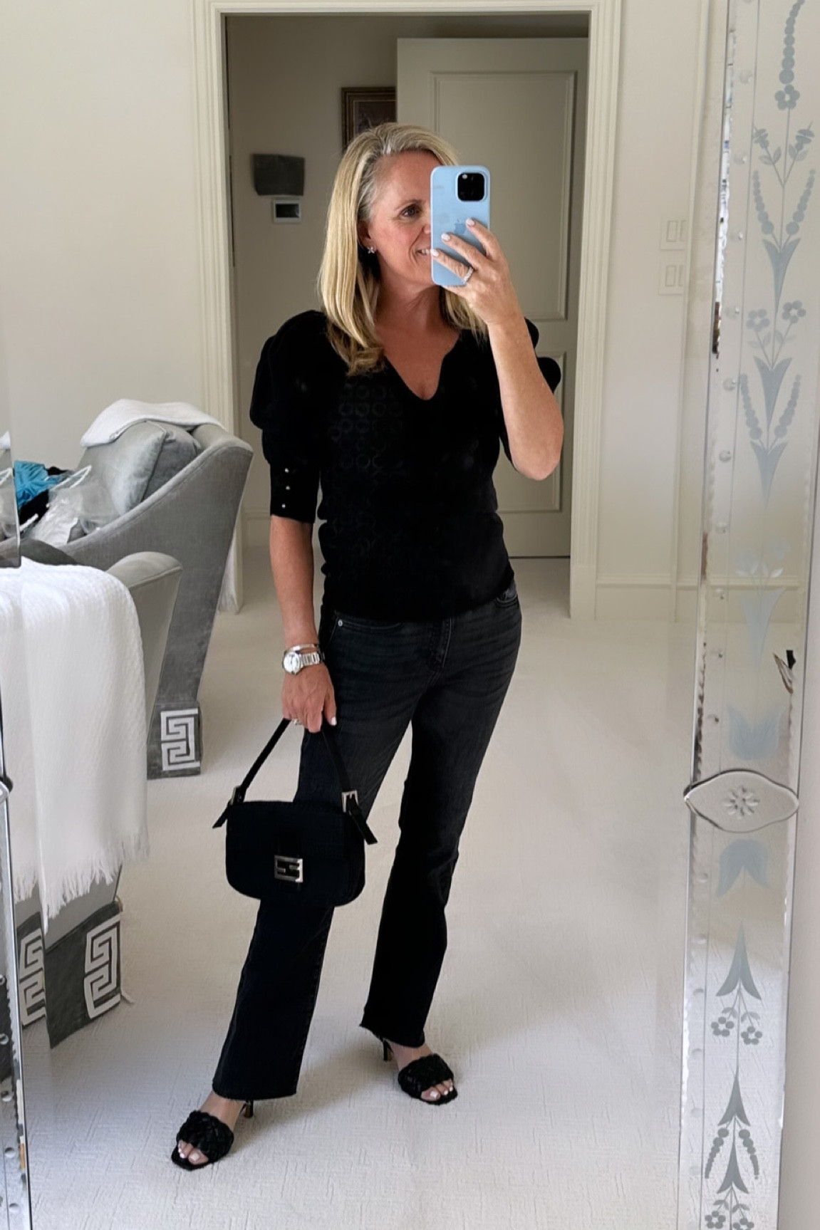 Black puff sleeve sweater with gold button details
Black wash cropped boot cut denim under $100 
Black woven slide sandals 
Fendi baguette bag

#LTKover40 #LTKstyletip #LTKfindsunder100