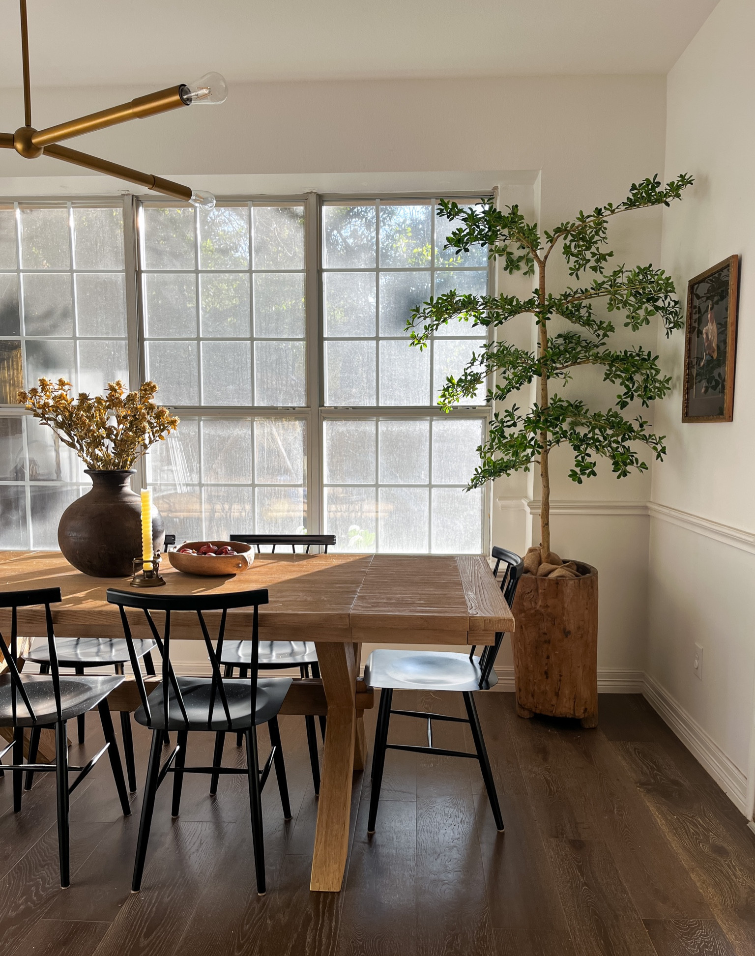 Faux black olive tree in dining room 

#LTKhome #LTKstyletip #LTKSeasonal