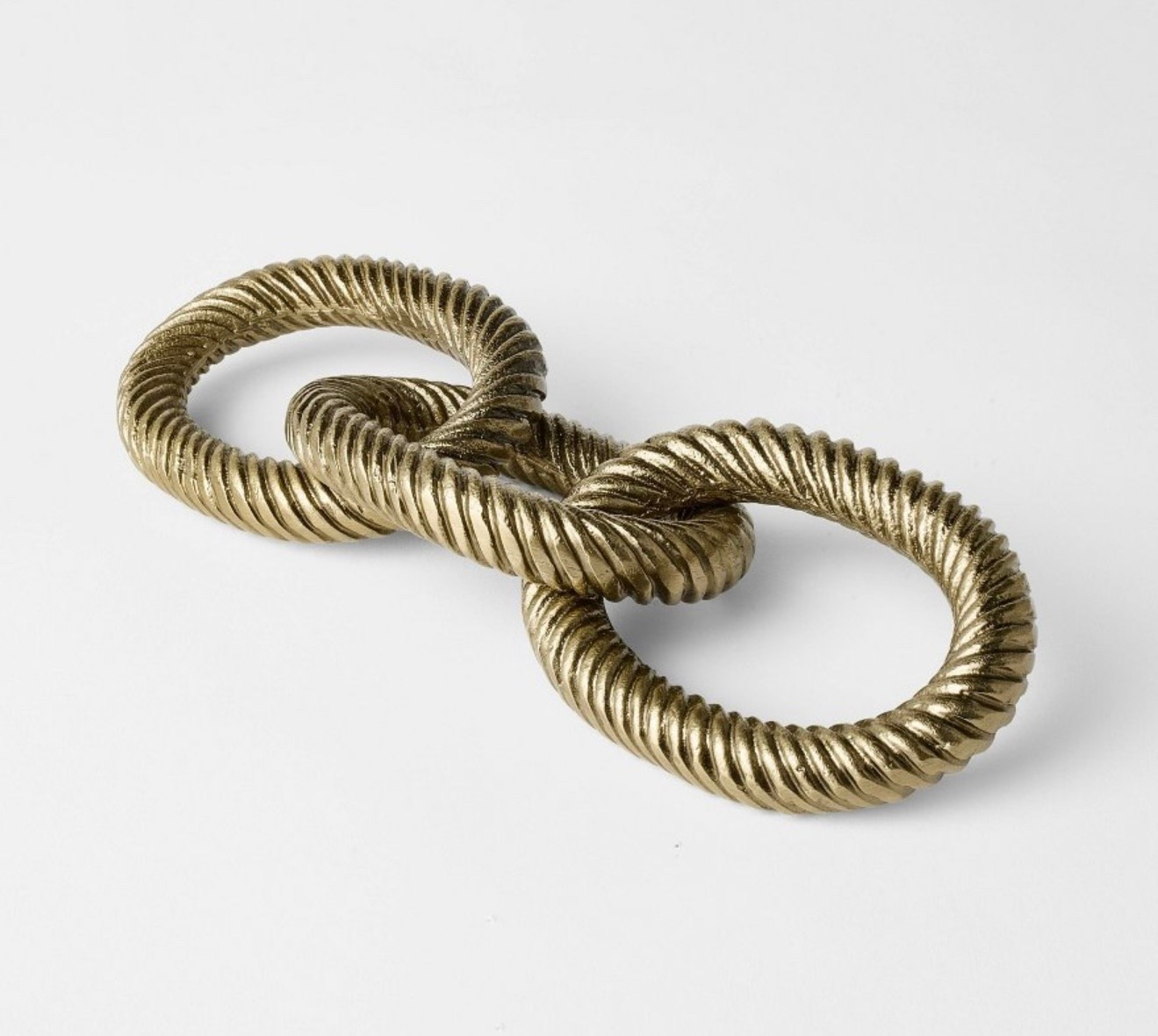Cast Metal Links from Threshold™ designed with Studio McGee. These metal decorative links feature a twisted rope design in a gold-tone hue for a luxe appeal.

#LTKHome #LTKFindsUnder50