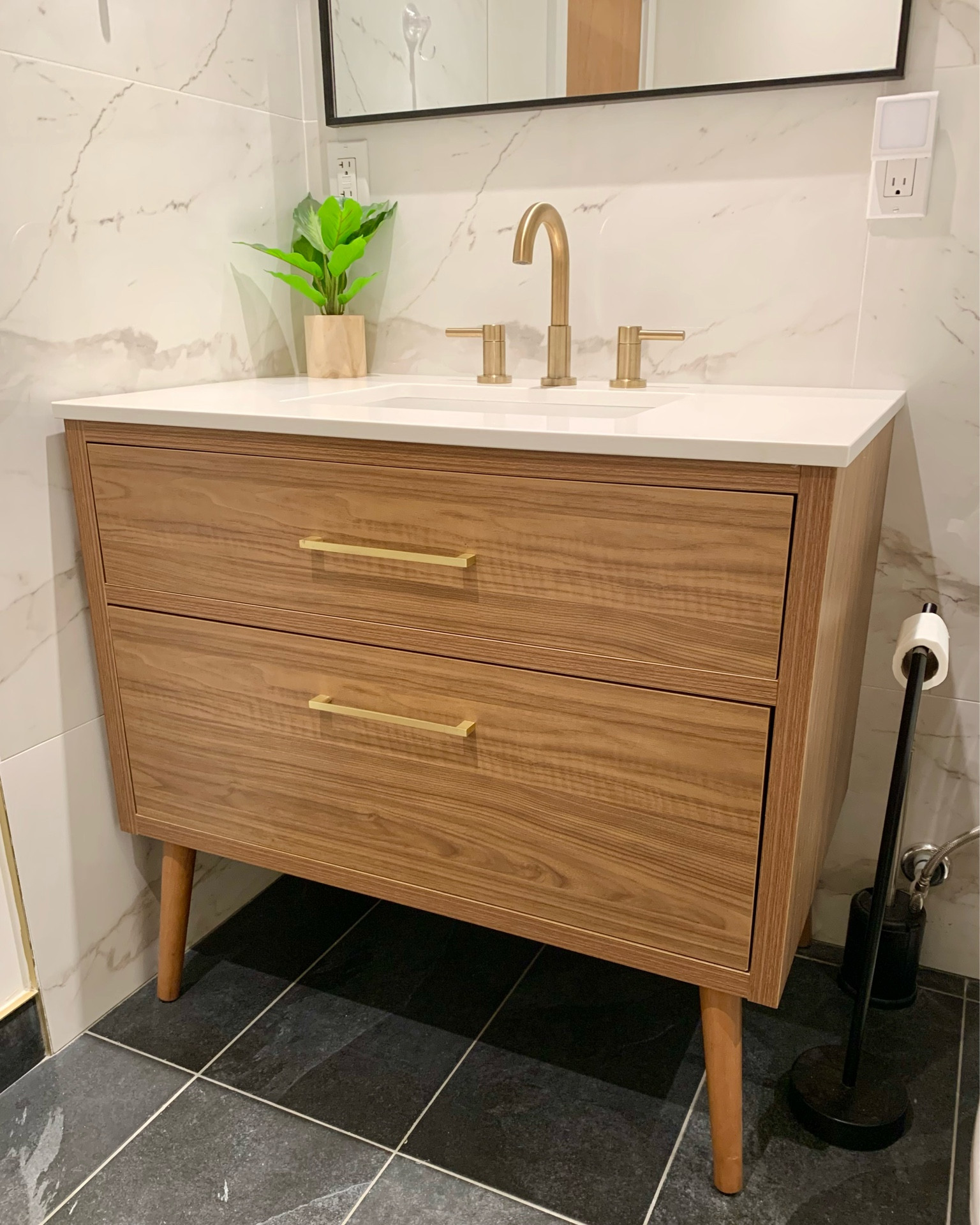 Bathroom is almost complete!  In staying with the neutral and black mid-century modern style, we used a black mirror, gold brass vanity light, a walnut wood color vanity (mine is 36”). Marble like porcelain tile wall really elevates the room and covers the whole shower area too. Just need our new door hung.  Vanity comes in multiple sizes - linked below. 


Toilet paper holder
Gold faucet
Gold hardware
Toilet
Wayfair
Lowes
Pottery Barn

#LTKfamily #LTKhome #LTKsalealert