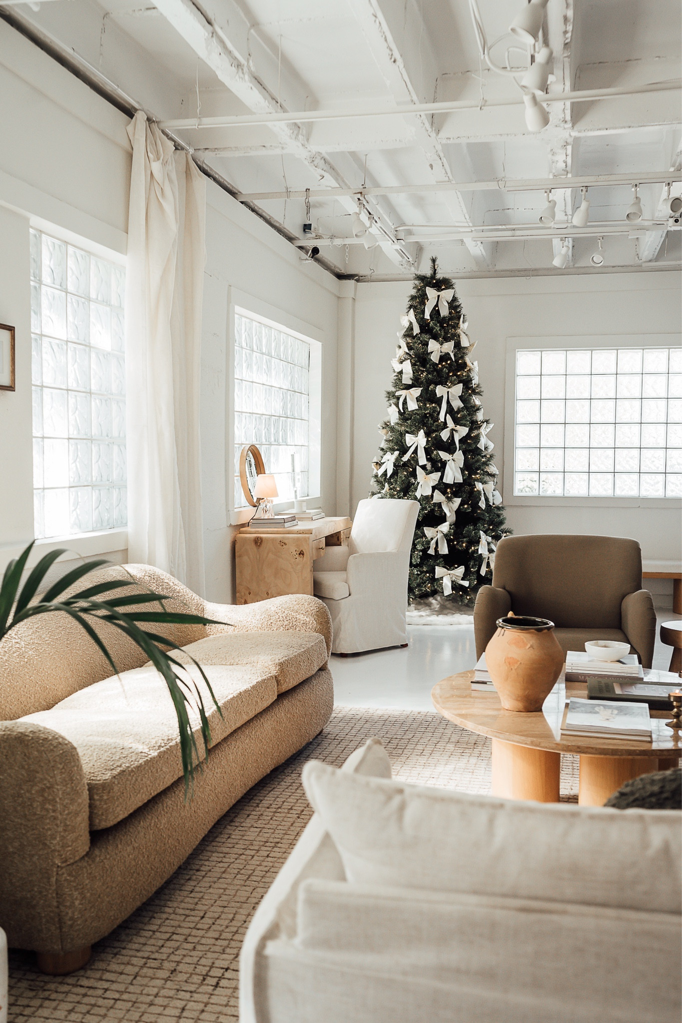 Christmas decor: Christmas bows, Christmas tree, accent chairs, sofa, rug

#LTKStyleTip #LTKHoliday #LTKHome