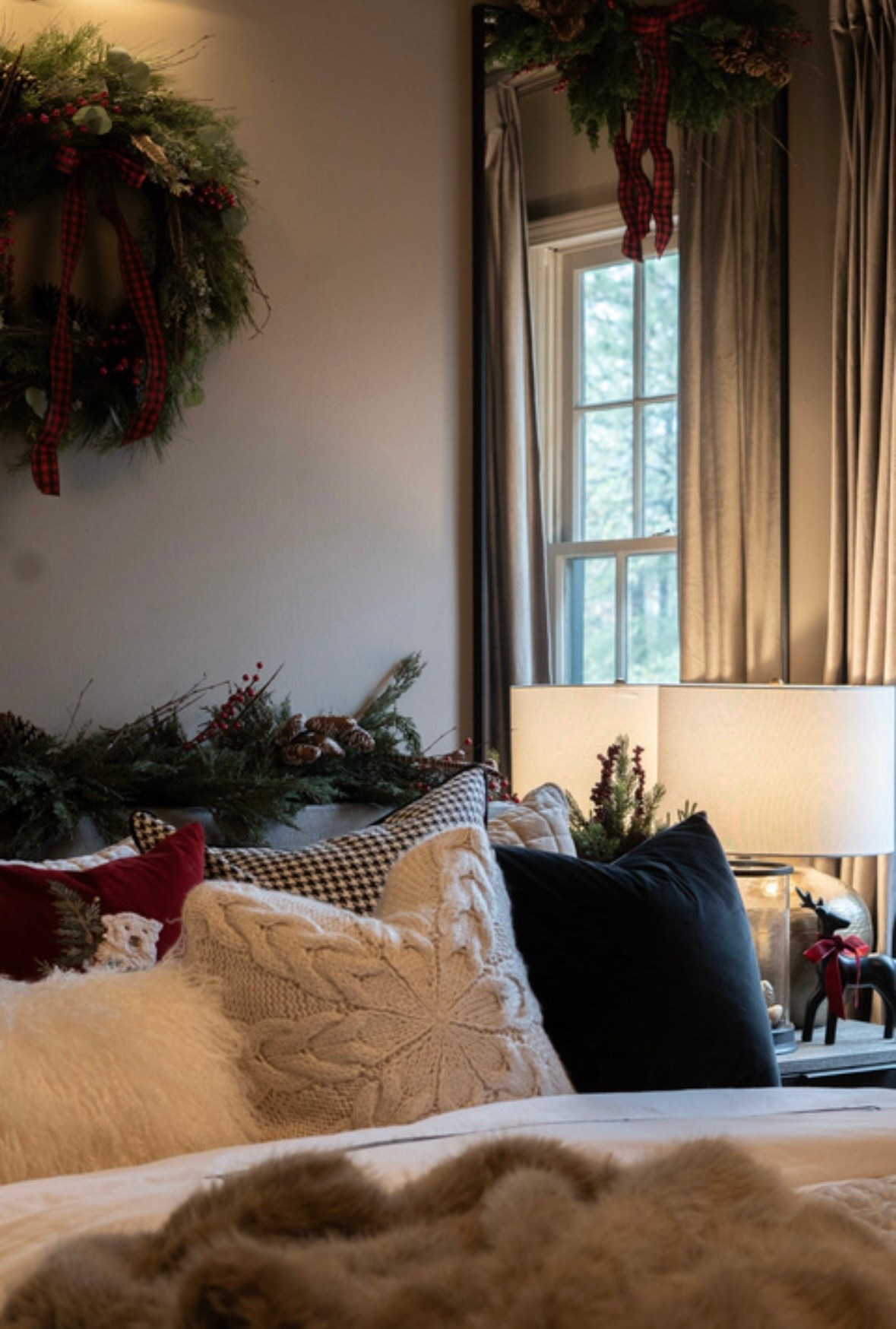 This cozy holiday bedroom is everything I wanted for a warm, inviting winter retreat. Layered textures, cable-knit pillows, faux fur throws, soft lighting, and fresh greenery create a cozy, elevated Christmas look that feels timeless and intentional. These simple holiday décor touches—garlands, wreaths, classic plaid, and deep seasonal tones—transform the space into a peaceful, festive sanctuary. If you’re searching for Christmas bedroom inspiration or ways to make your home feel warm and beautifully styled for the season, this is your sign to lean into texture, greenery, and soft, glowing light.

#LTKHoliday #LTKSeasonal #LTKHome