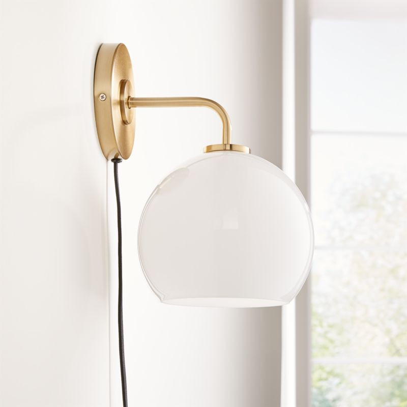 Arren Brass Plug In Wall Sconce Light with Milk Round Shade + Reviews | Crate & Barrel | Crate & Barrel