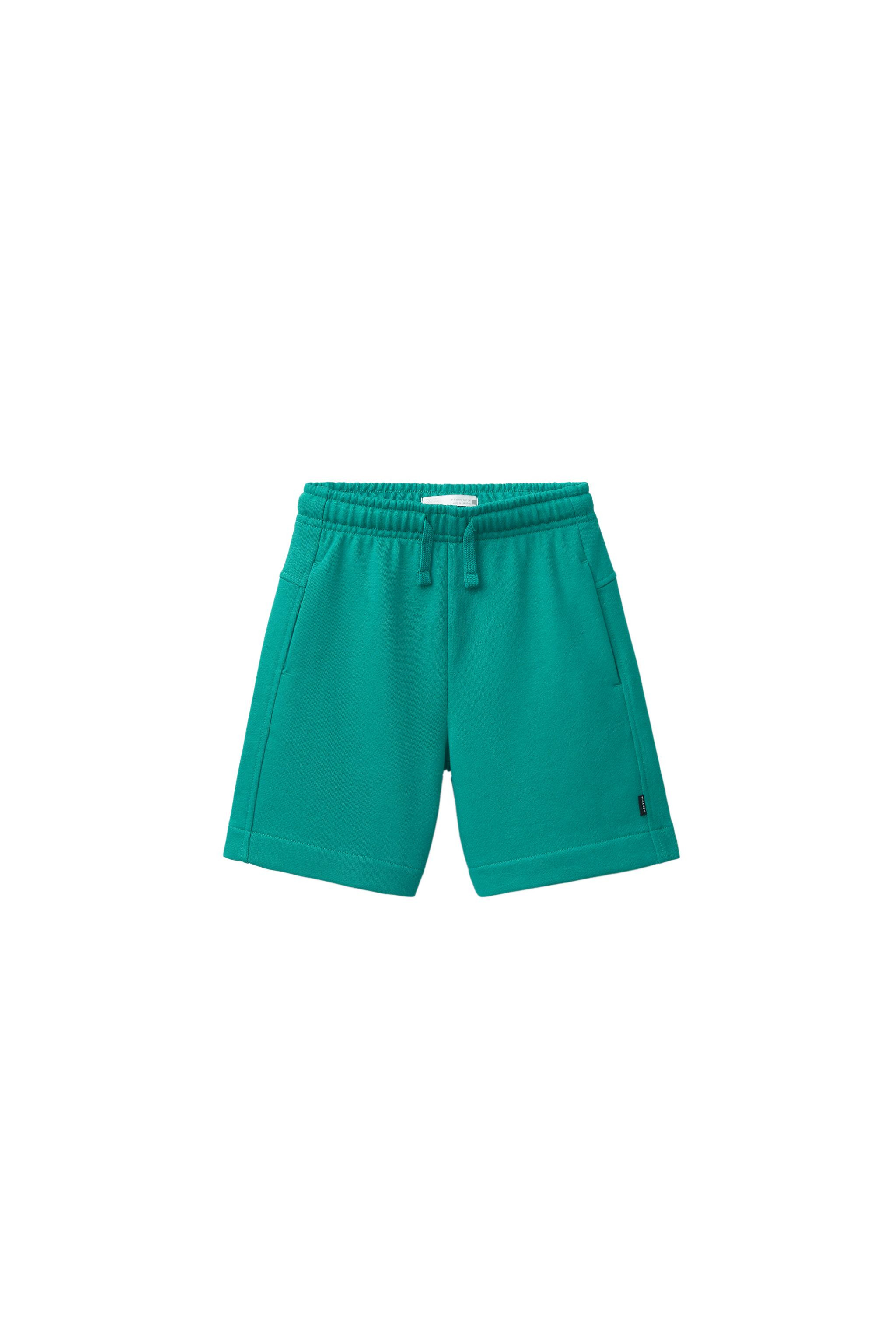 Plush shorts with elastic waistband and adjustable front drawstring. Front pockets and side label... | Zara US