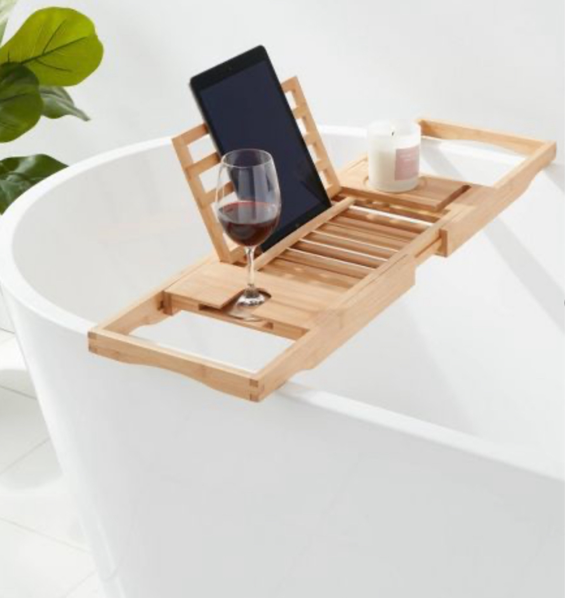 Bamboo bathtub tray (extendable) - The thing I never knew I needed until I received it as a gift! It holds wine, a candle, ipad and cell phone, plus has room for a tray of nibbles/snacks! 

#LTKFindsUnder50 #LTKHome #LTKFindsUnder100