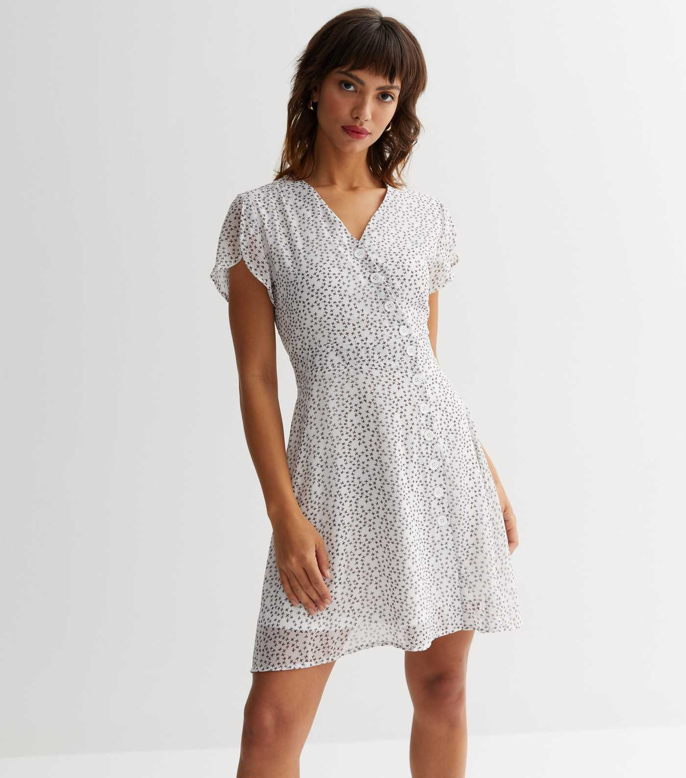 Sunshine Soul White Ditsy Floral Button Mini Dress
						
						Add to Saved Items
						Remove f... | New Look (UK)