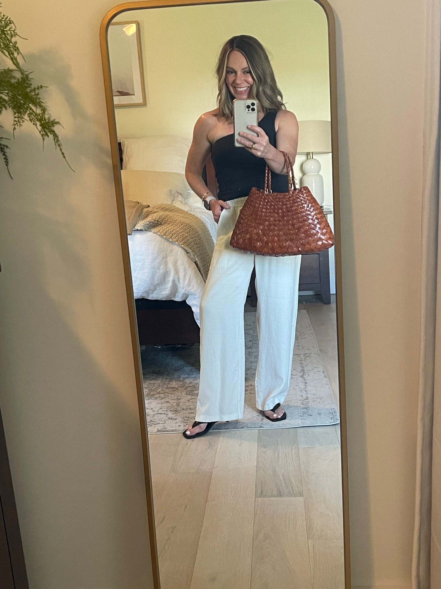 Summer date night look, dressing up my favorite linen pants with an asymmetrical  tank and a simple kitten heel! 
#petite #LTKover50

Pants - Splendid, XS  (fit full length on petites)
Tank - JCrew older, linked similar
Heels - Open Edit, Nordstrom under $50, fit tts
Bag - Dragon Diffusion, Santa Croce small


#LTKFindsUnder50 #LTKSummerEdit #LTKPetite