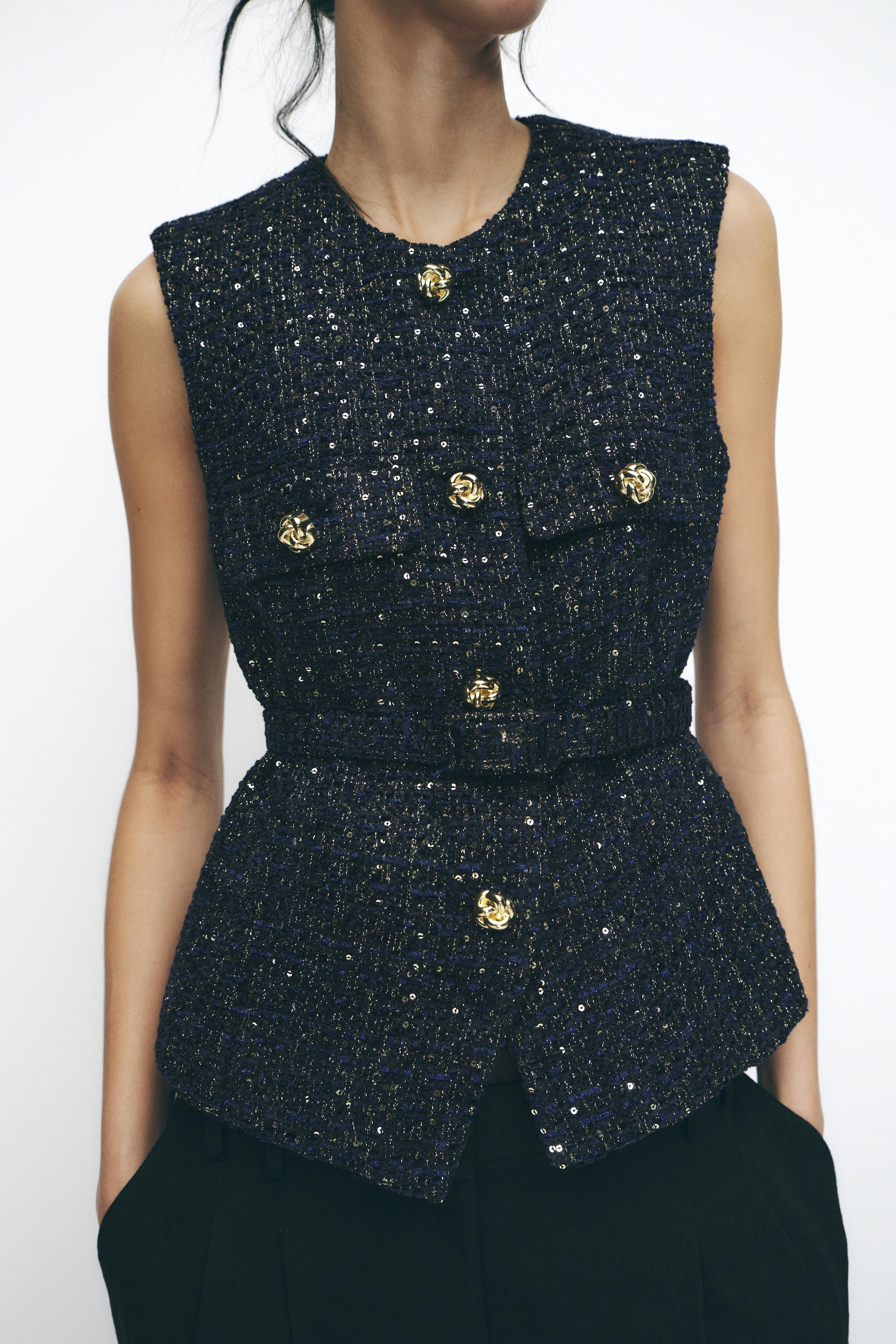 Sleeveless round neck vest. Matching belt and front flap faux pockets. Front pockets. Gold button... | Zara US