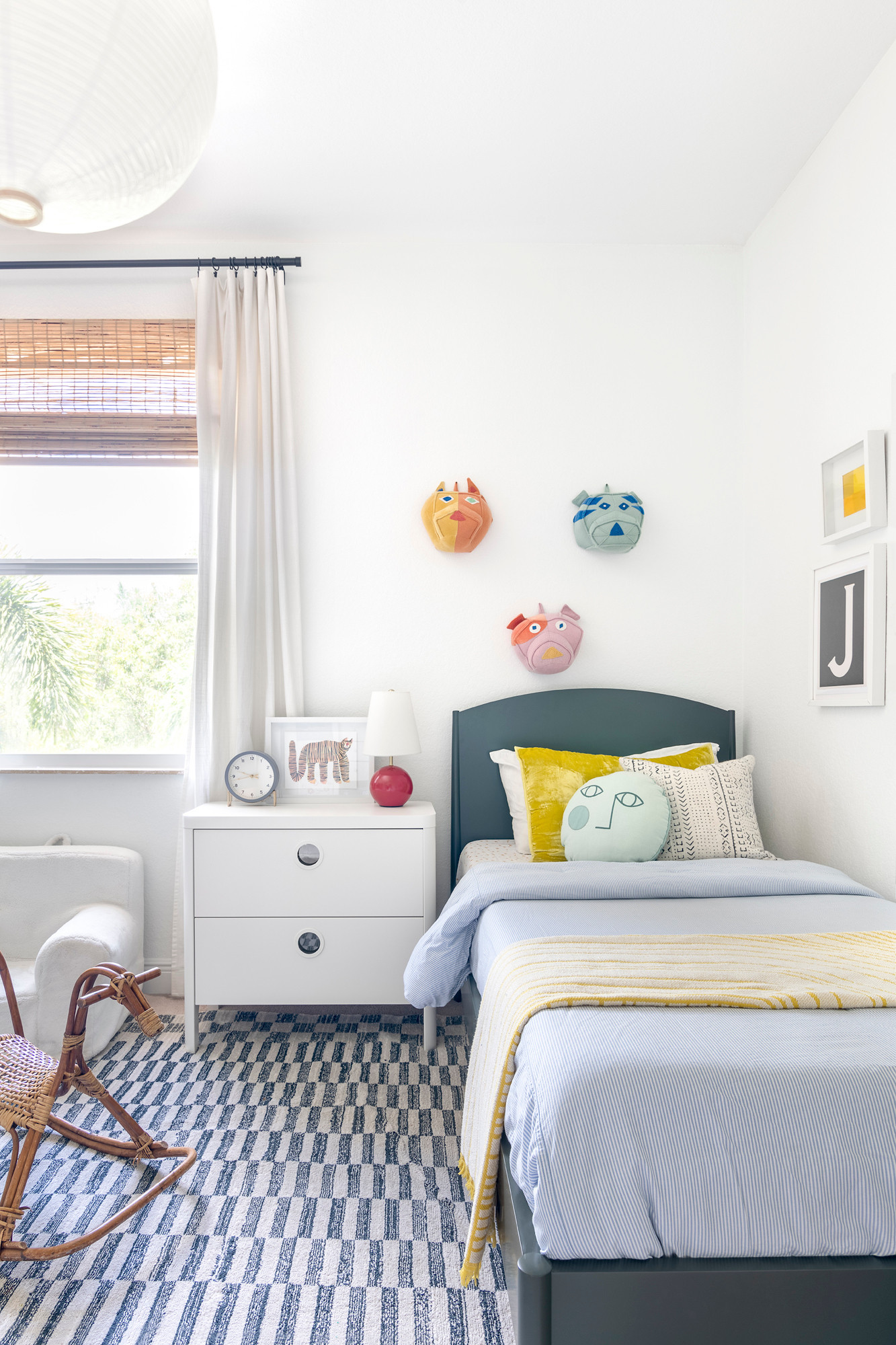 This kids' bedroom is a fun, functional space with a sleek double work desk, rattan chairs, and vibrant accents for learning and play. Playful decor like the "Color Outside the Lines" sign adds personality and inspires creativity. 

 #LTKHome #LTKKids #LTKFamily