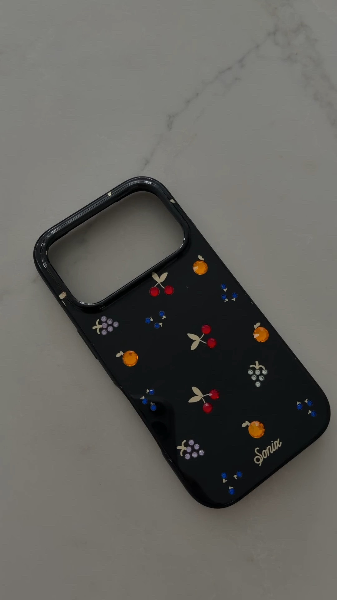 So obsessed with this rhinestone fruit case 🍒🍊🍇🫐