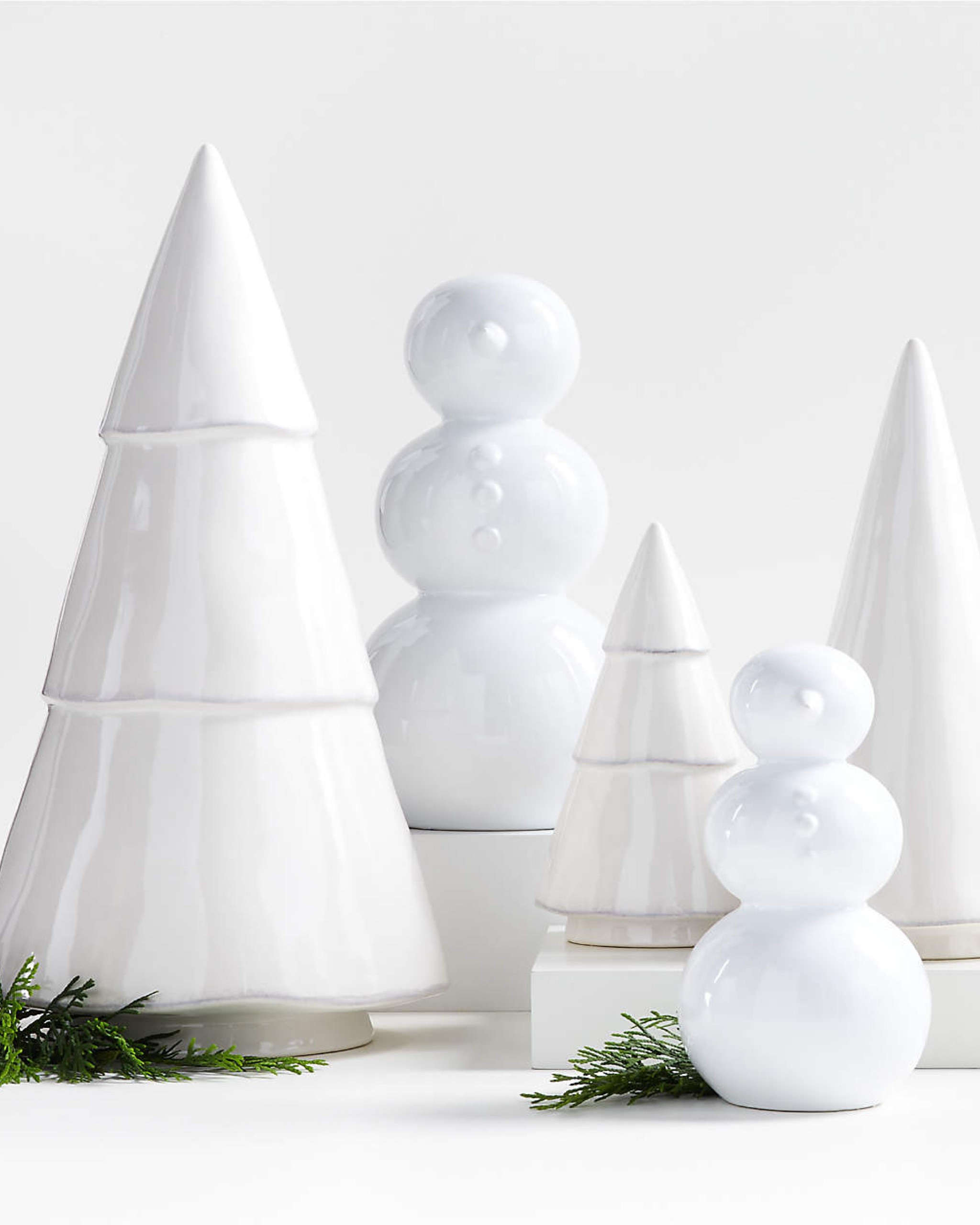 Add a playful, modern touch to your holiday decor with this charming set of three ceramic snowmen. Each piece features the classic stacked-sphere shape, capturing the unmistakable form of a snowman in a clean, minimalist style. Crafted from white-glazed stoneware, these exclusive snowmen are adorned with simple button dots and cone-shaped noses, letting their classic silhouette shine. Perfect for creating a delightful winter display, this trio comes in small, medium, and large sizes, making it easy to arrange them together for a cozy, festive look.

#LTKSeasonal #LTKHoliday #LTKHome