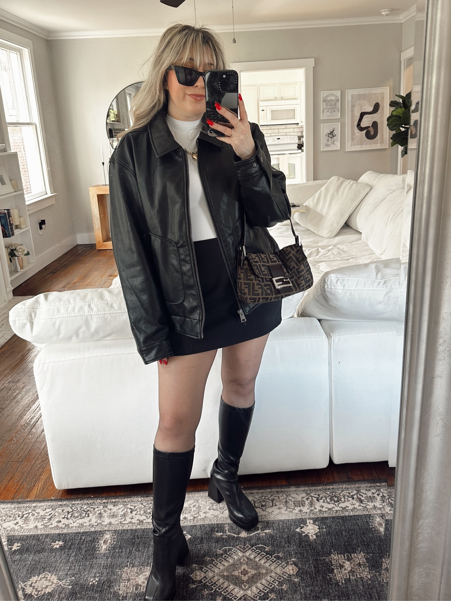 Classic winter outfit - oversized bomber jacket, white tee, skort and gogo boots 

#LTKSeasonal #LTKstyletip
