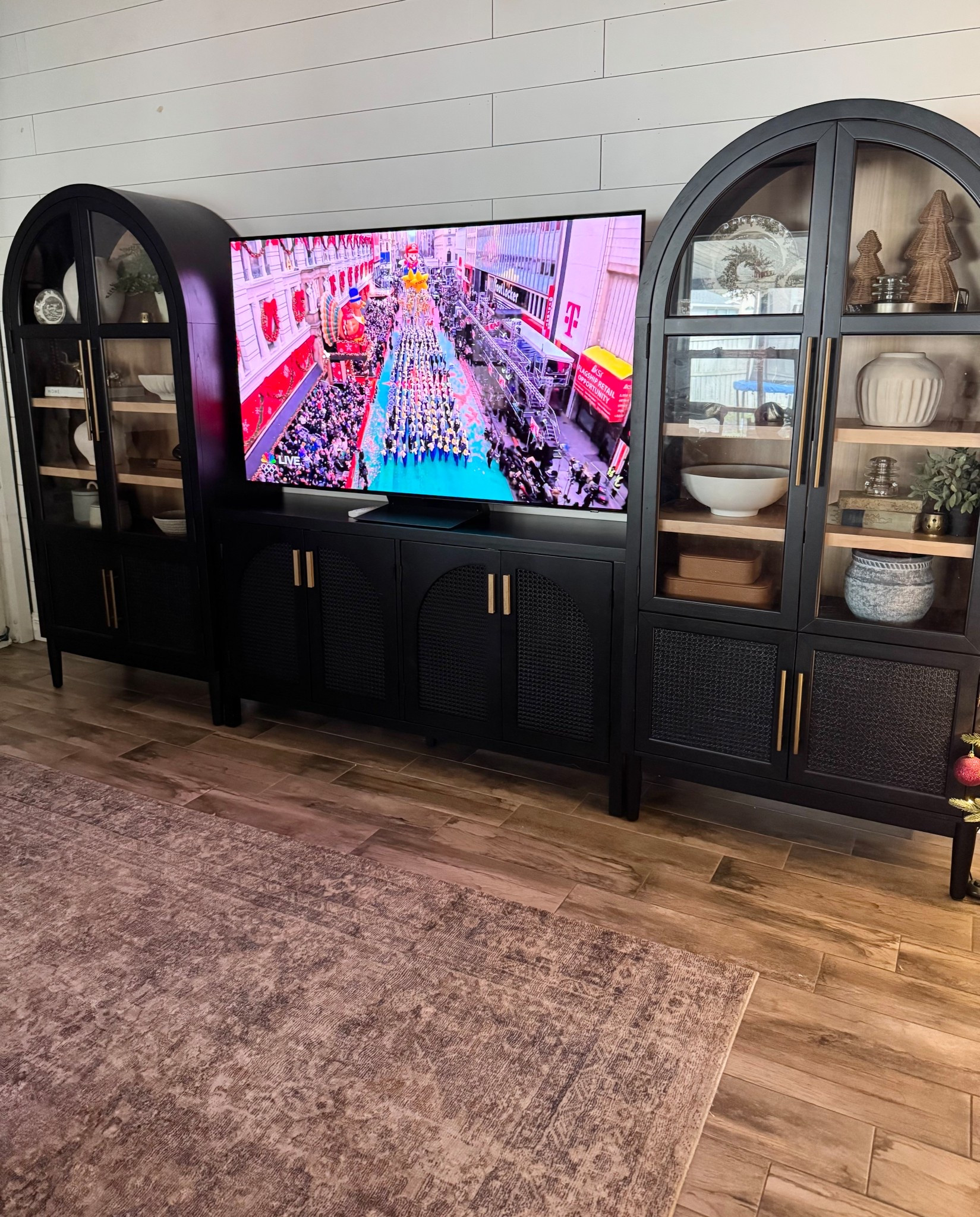 Christmas shelf decor, arched cabinet, black arched cabinet, black console table, wicker Christmas trees, Christmas decor, wood Christmas tree, ceramic bowl, ceramic vase, pine stems, Norfolk pine stems, ceramic Christmas tree, books

#LTKSeasonal #LTKHome #LTKHoliday