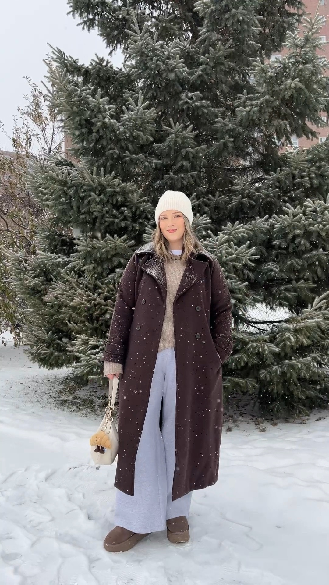 Snow day outfit! Wearing my usual size L in the chocolate brown wool trench coat - it’s so warm and such a good staple piece! Also wearing L in the wide leg sweatpants, these are thick and cozy and cute enough to wear out! This white tee is my fave for layering since the neck is higher, wearing my usual size L. My Ugg style boots are Amazon and such good quality! I’m usually a 9.5-10 and wear a 10 in these. Linked similar neutral sweaters & cream beanie

#LTKwinter #LTKstyletip #LTKmidsize