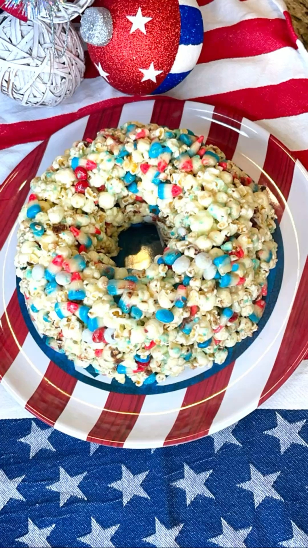 Snap, crackle,
Pop and I’m OBSESSED! Twist on a traditional popcorn cake with patriotic candy corn, M&Ms and POPROCKS! 

Memorial Day, July 4th recipes,
4th of July, patriotic, unique recipes, fun with food, popcorn, easy desserts, easy recipes 

#LTKvlog #LTKfoodie #LTKSeasonal