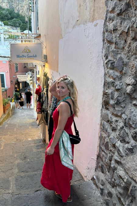 This belt bag was inexpensive and held so much! Also, it is RFID which is perfect for international travel. I tied a scarf around it when dressing up. | Dress - purchased in Positano, Scarf, Bag, Necklace, Sandals

#LTKItBag #LTKStyleTip #LTKTravel