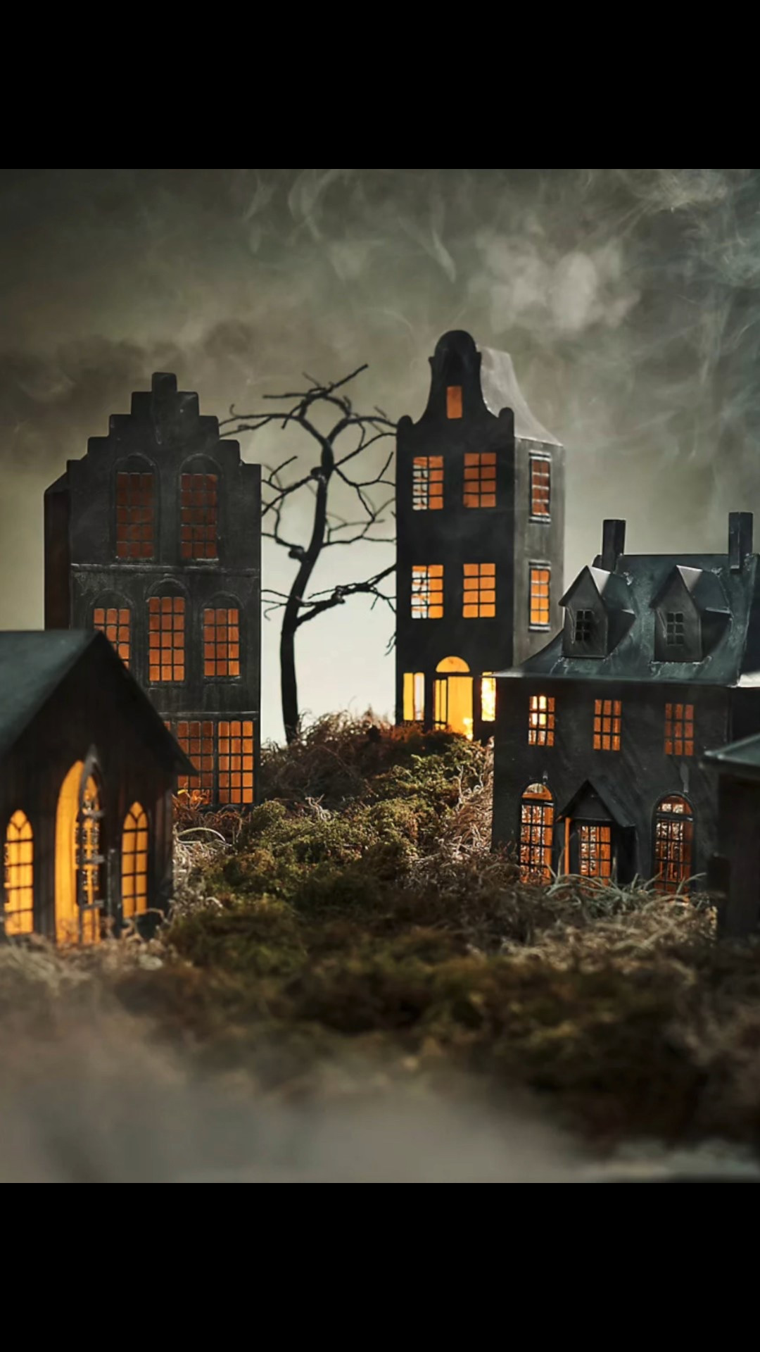 Create your own haunted neighborhood with these amazing houses and black wire trees.  Incorporate moss and battery lights to set the scene!  

#LTKSeasonal #LTKautumn #LTKHome